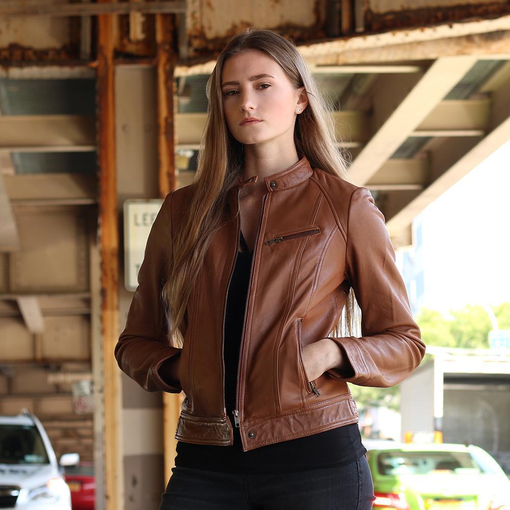 A stylish women's leather jacket made of genuine lambskin, featuring a zipper front, long sleeves with adjustable cuffs, and multiple pockets.