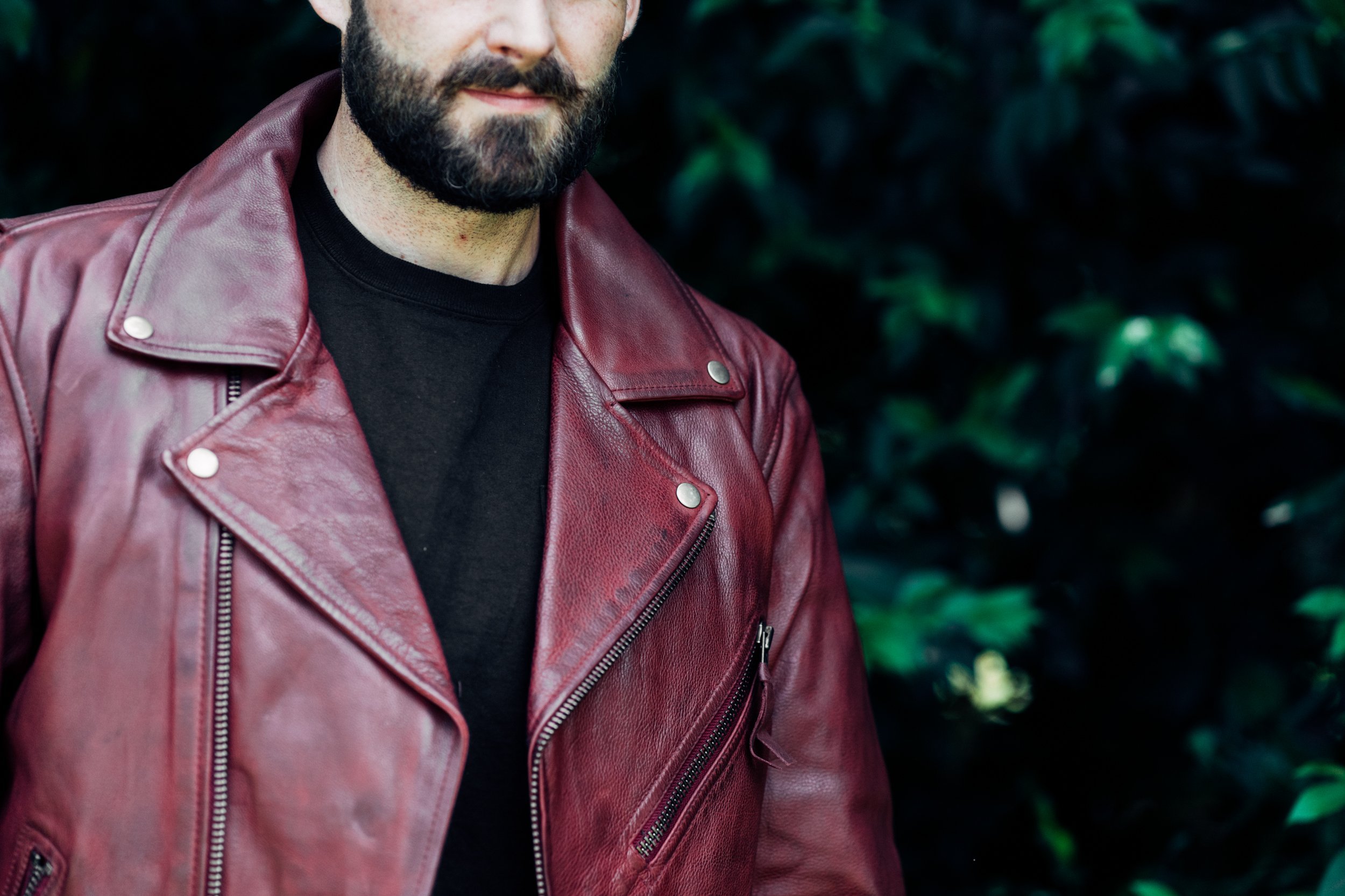 Fillmore Men's Leather Motorcycle Jacket in Oxblood, featuring asymmetrical zipper and snap-down collar.