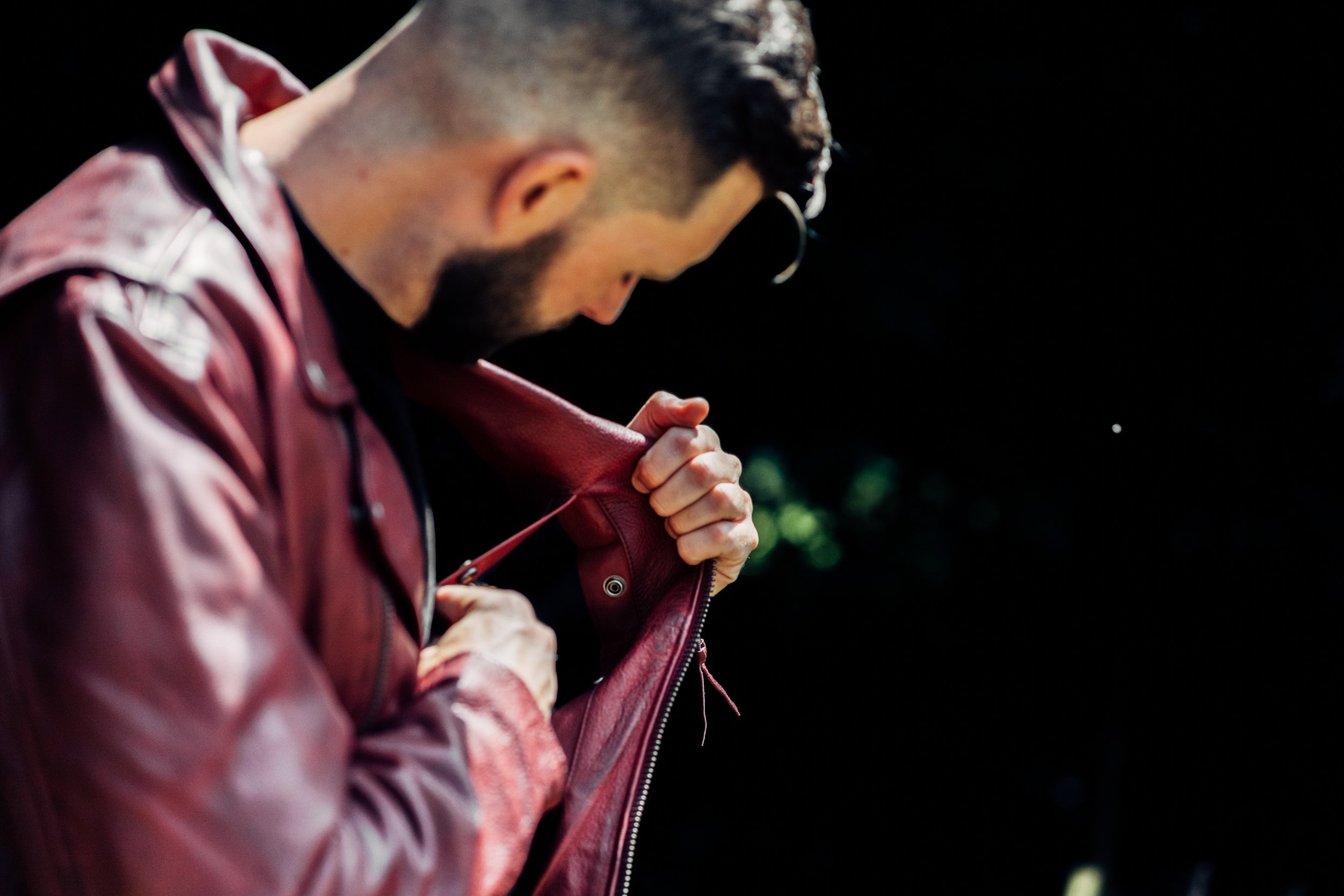 Fillmore Men's Leather Motorcycle Jacket in Oxblood, featuring asymmetrical zipper and snap-down collar.