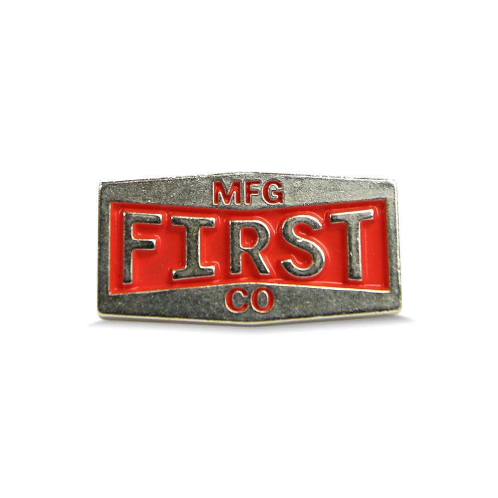 A detailed view of the First Metal Badge showcasing its unique design and high-quality metal finish.