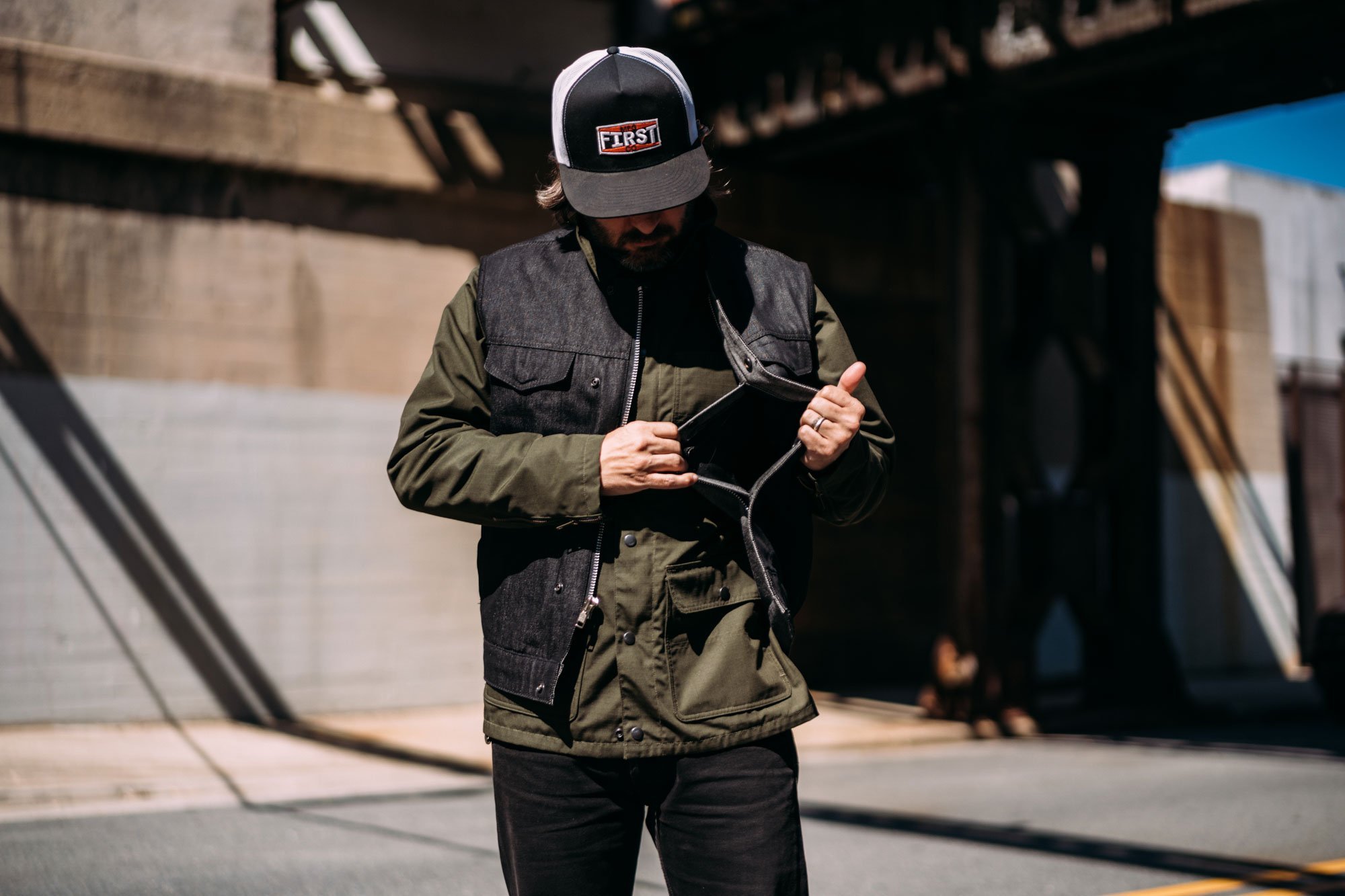 Haywood Black Denim Men's Motorcycle Vest featuring rough neck denim, multiple pockets, and a stylish design.