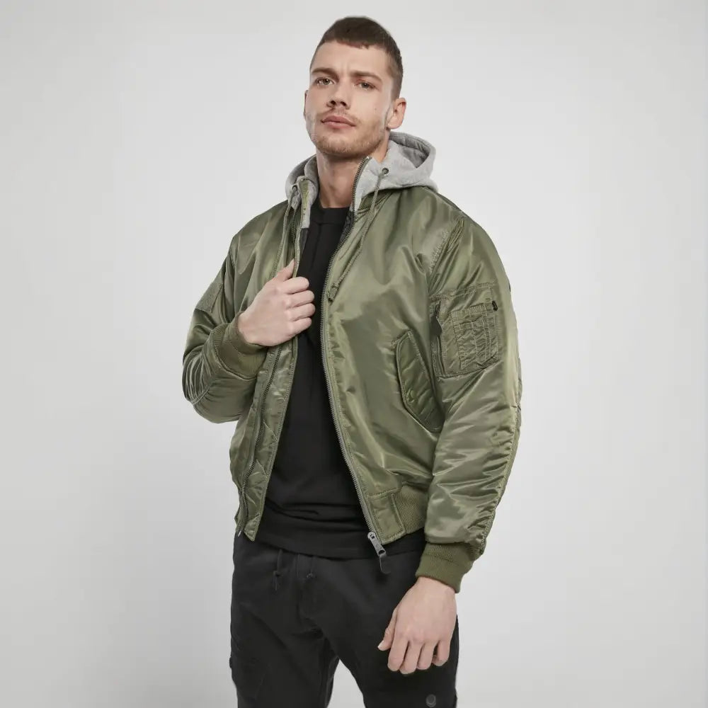 Hooded MA1 Bomber Jacket featuring a warm lining, adjustable drawstring hood, and multiple pockets, made from durable nylon material.