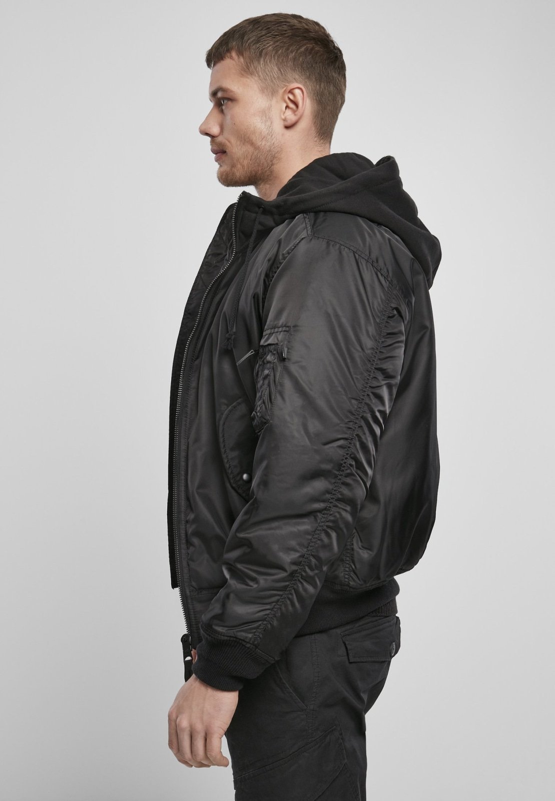 Hooded MA1 Bomber Jacket featuring a warm lining, adjustable drawstring hood, and multiple pockets, made from durable nylon material.