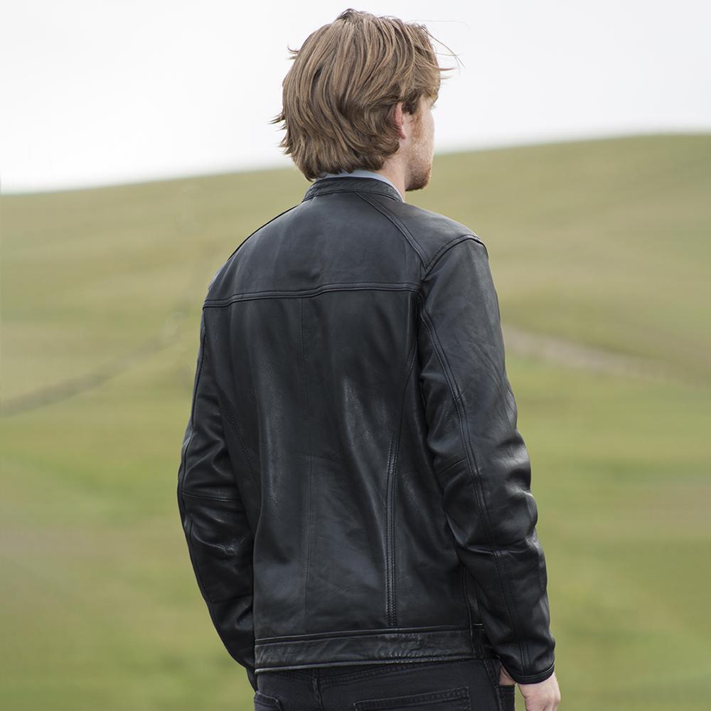 Iconoclast Men's Leather Jacket made from genuine sheepskin leather, featuring a classic fit, front snap collar, and multiple pockets.