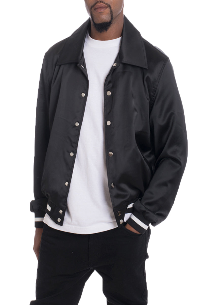 A stylish Luxe Satin Bomber jacket in a rich color, featuring a snap button closure and a single inner chest pocket, displayed on a mannequin.