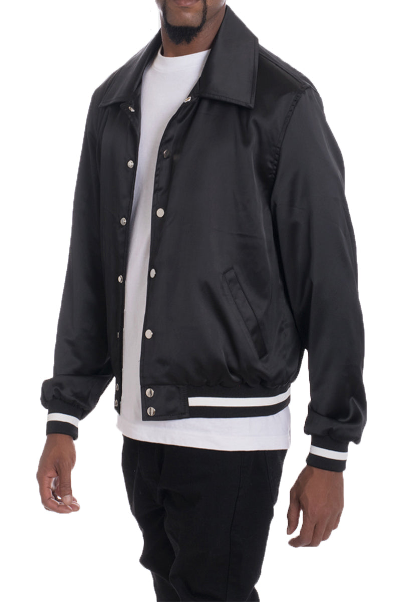 A stylish Luxe Satin Bomber jacket in a rich color, featuring a snap button closure and a single inner chest pocket, displayed on a mannequin.