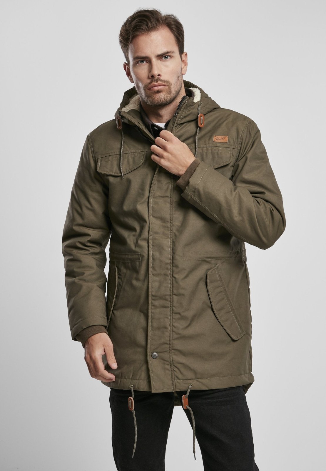 Marsh Lake Parka Jacket featuring a fishtail design, quilted lining, and leather applications, perfect for winter wear.