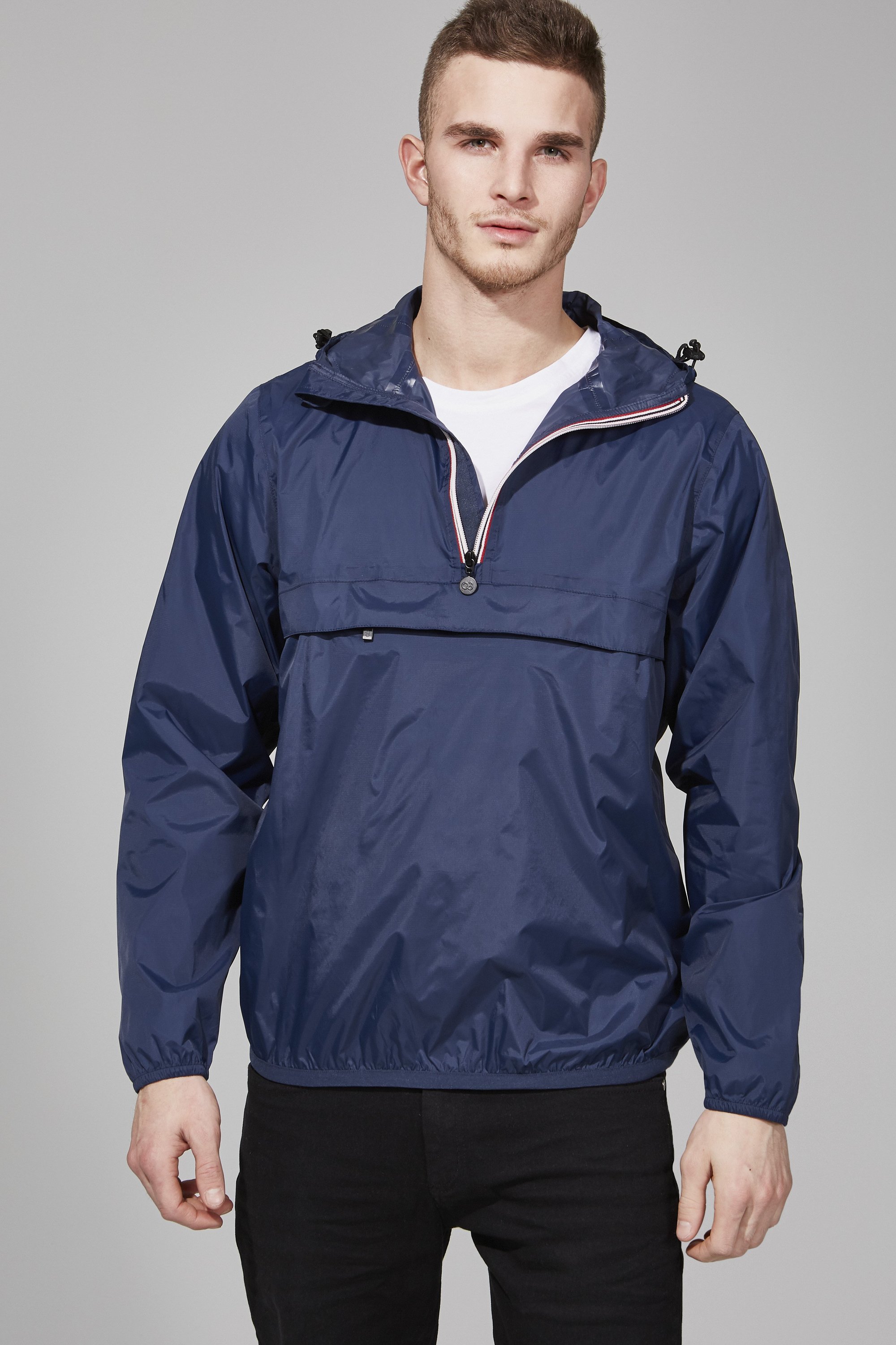 Men's navy quarter zip packable rain jacket, showcasing its sleek design and packable feature, ideal for outdoor activities.