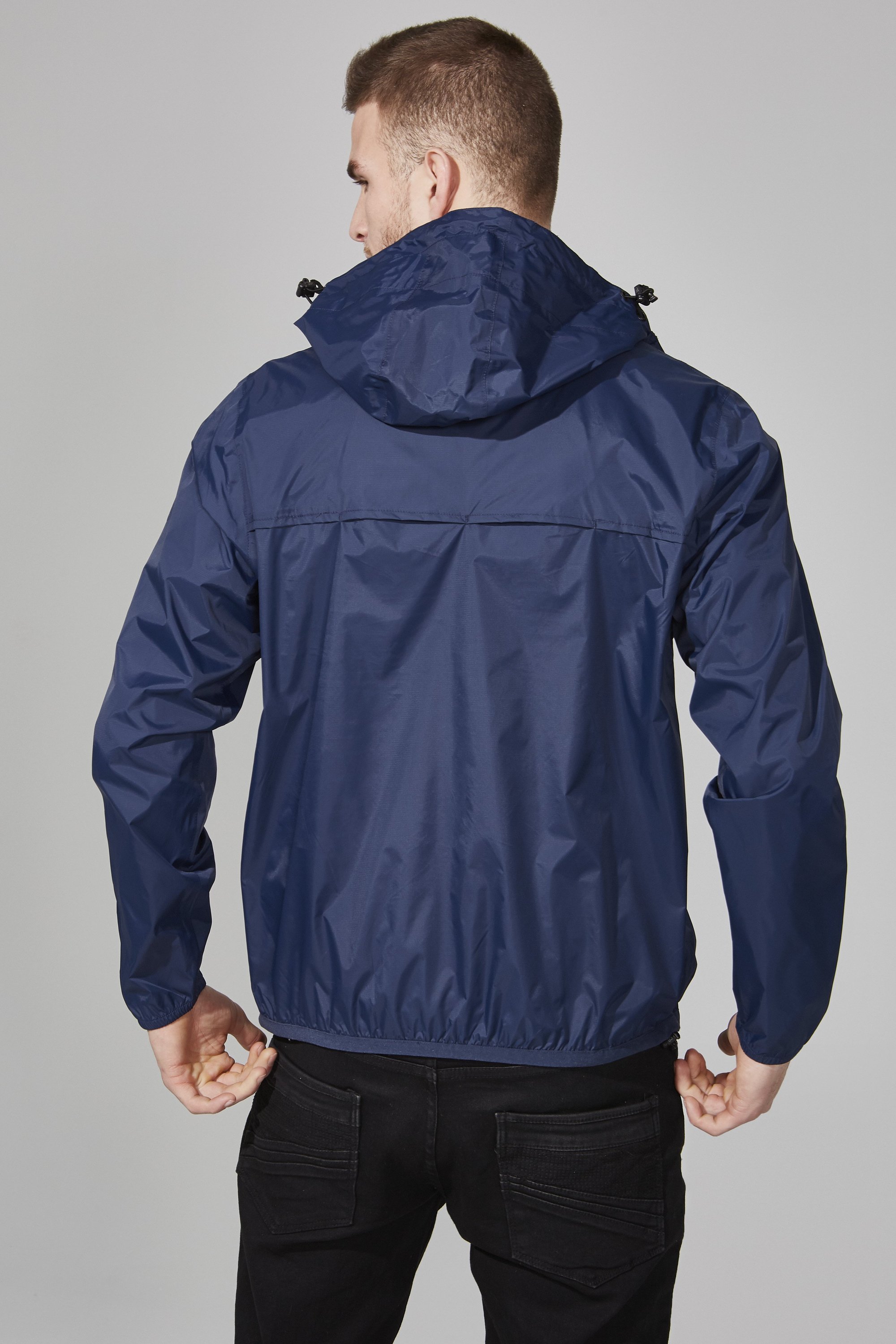 Men's navy quarter zip packable rain jacket, showcasing its sleek design and packable feature, ideal for outdoor activities.