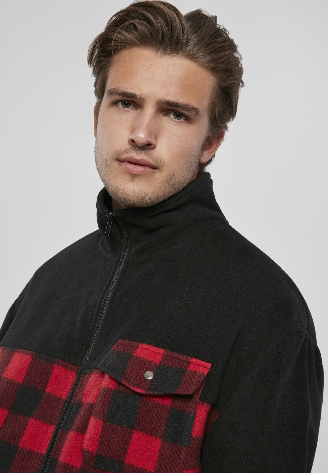 Men's Patterned Polar Fleece Track Jacket featuring a black top and plaid bottom, zip fastener, and practical pockets.