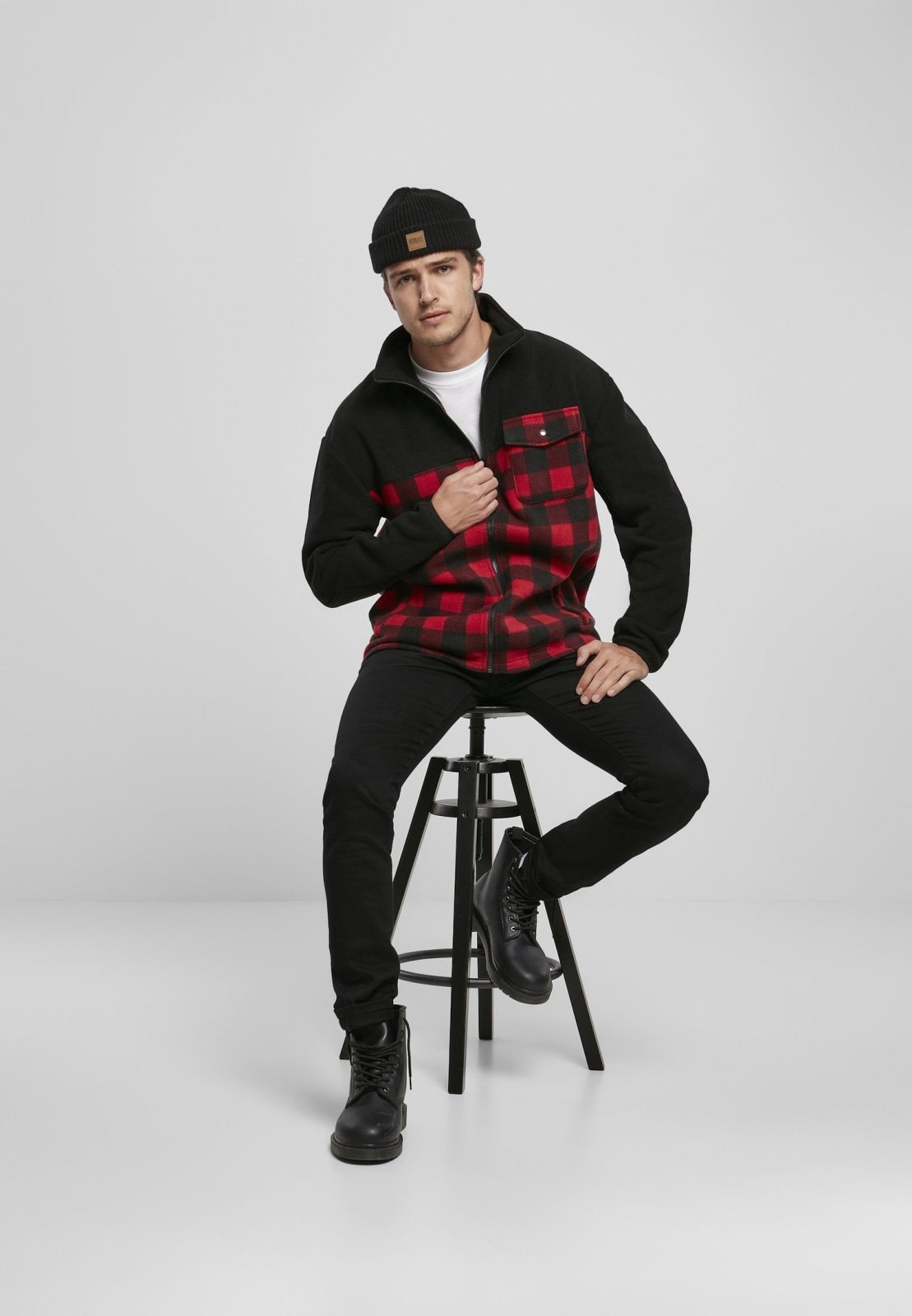 Men's Patterned Polar Fleece Track Jacket featuring a black top and plaid bottom, zip fastener, and practical pockets.