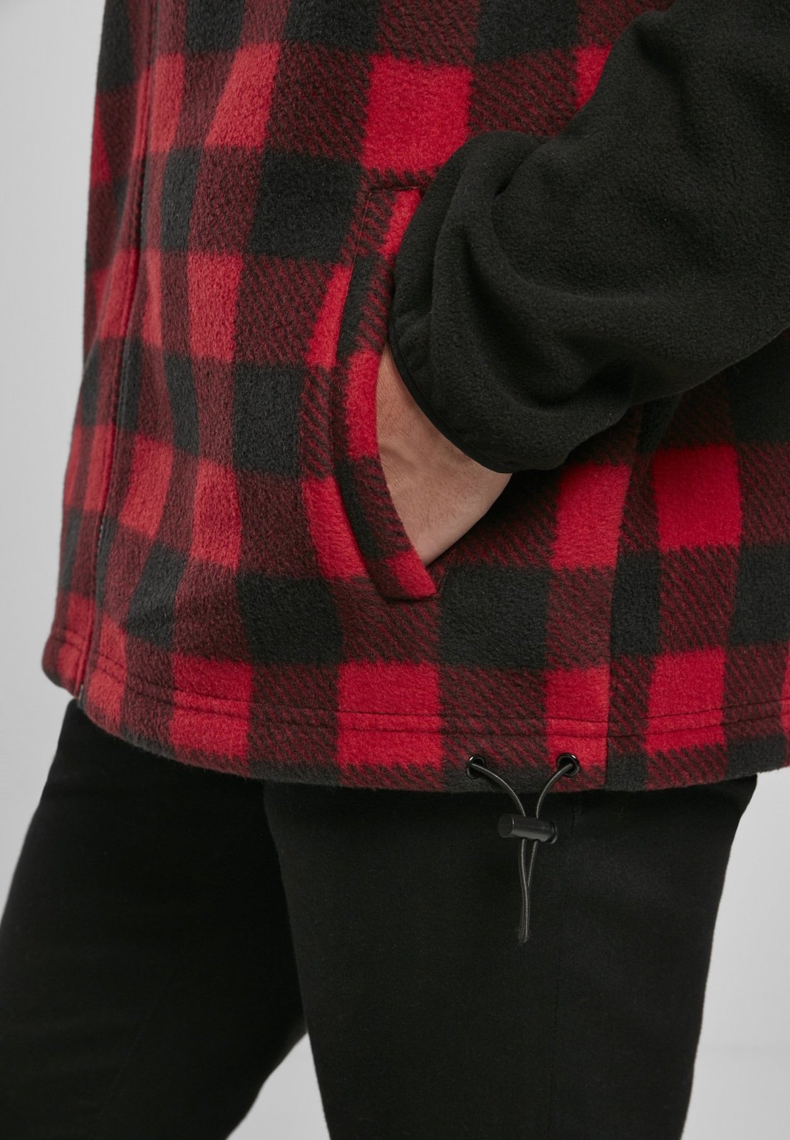 Men's Patterned Polar Fleece Track Jacket featuring a black top and plaid bottom, zip fastener, and practical pockets.