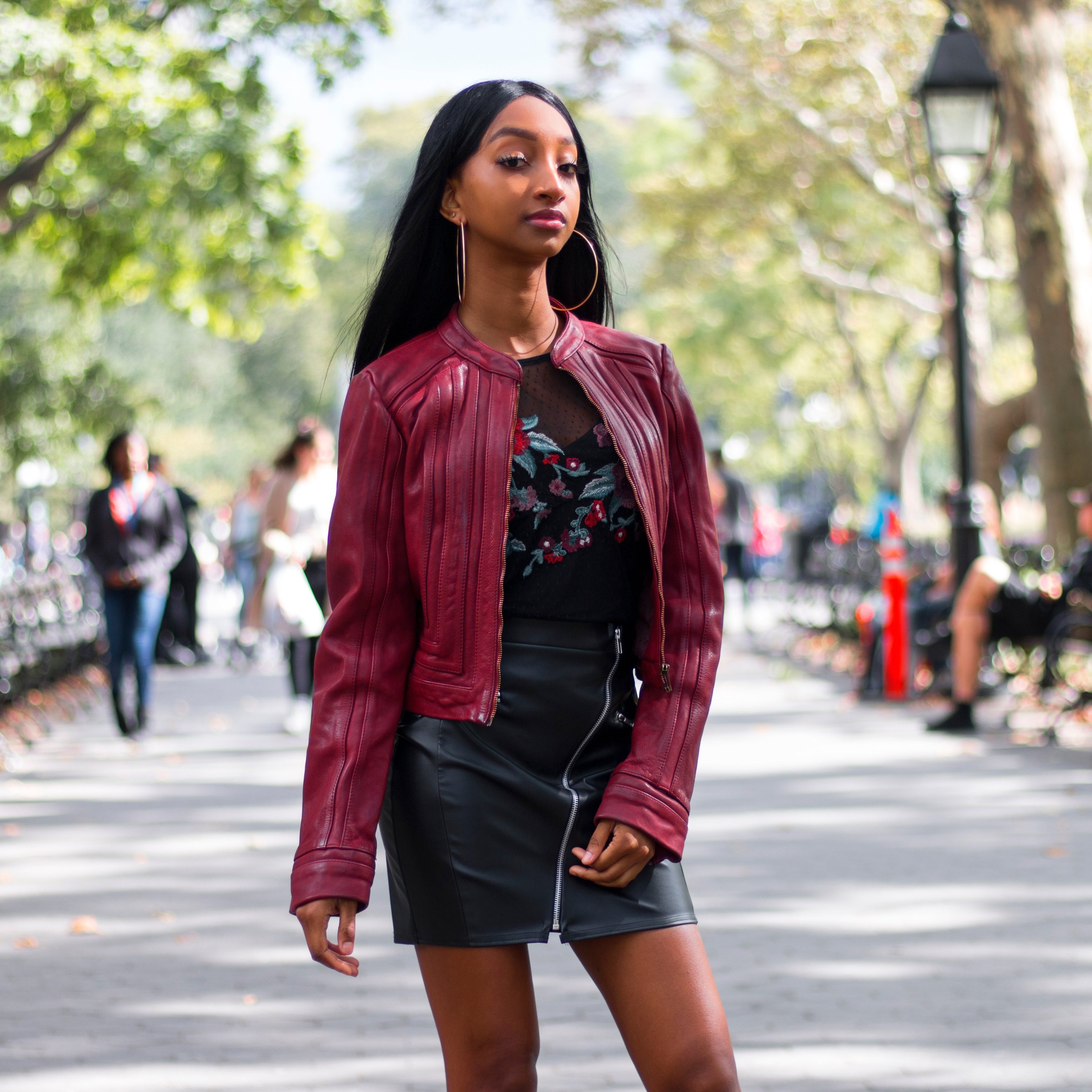 Pixie Women's Leather Jacket in oxblood with geometric design, featuring cropped fit and zip sleeves.