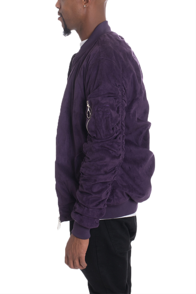 Plum faux suede bomber jacket with ribbed cuffs and pockets, showcasing a stylish design.