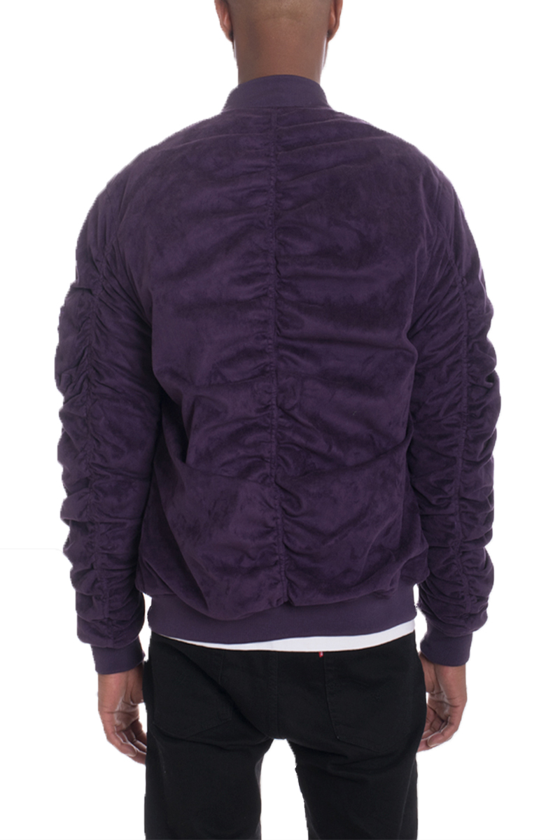 Plum faux suede bomber jacket with ribbed cuffs and pockets, showcasing a stylish design.