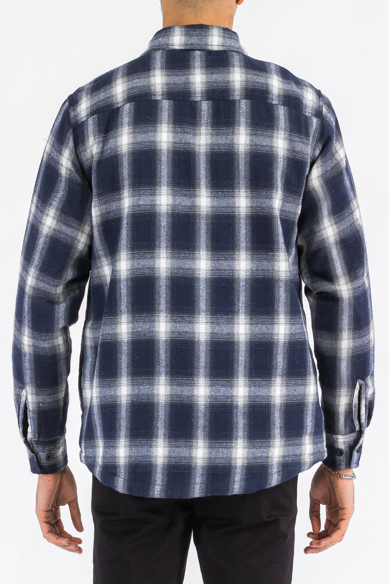 A stylish quilted flannel shirt featuring a button closure, cozy lining, and side pockets, perfect for layering and casual wear.