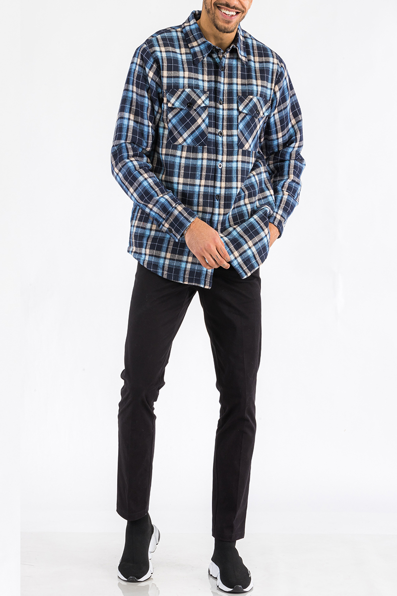 A stylish Quilted Flannel Shirt featuring a button closure, cozy quilted lining, and side pockets, perfect for layering and casual wear.