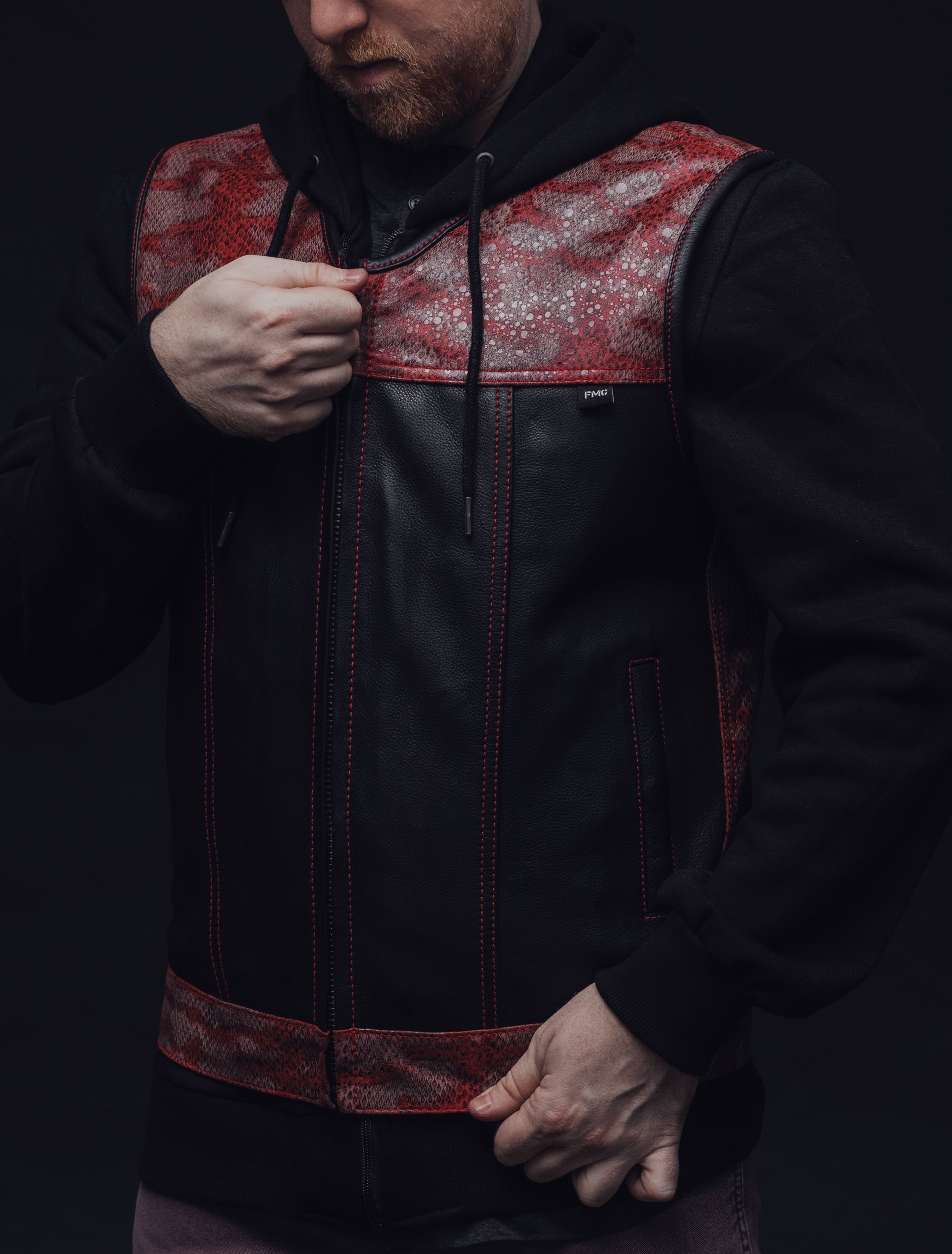 Red Racer Men's Euro Style Leather Vest featuring red stitching and snake design accents on a black leather background.