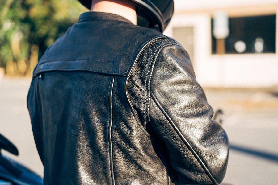 Revolt Men's Motorcycle Leather Jacket made from premium cowhide leather, featuring a stylish scooter design with multiple pockets and ventilation.