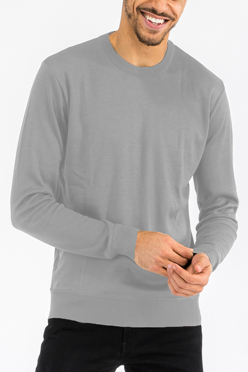 A stylish round neck knit sweater in a soft fabric, showcasing its regular fit and pull-over design.