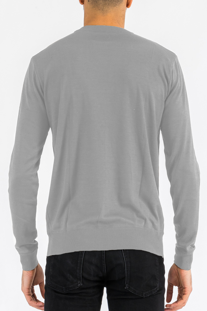 A stylish round neck knit sweater in a soft fabric, showcasing its regular fit and pull-over design.