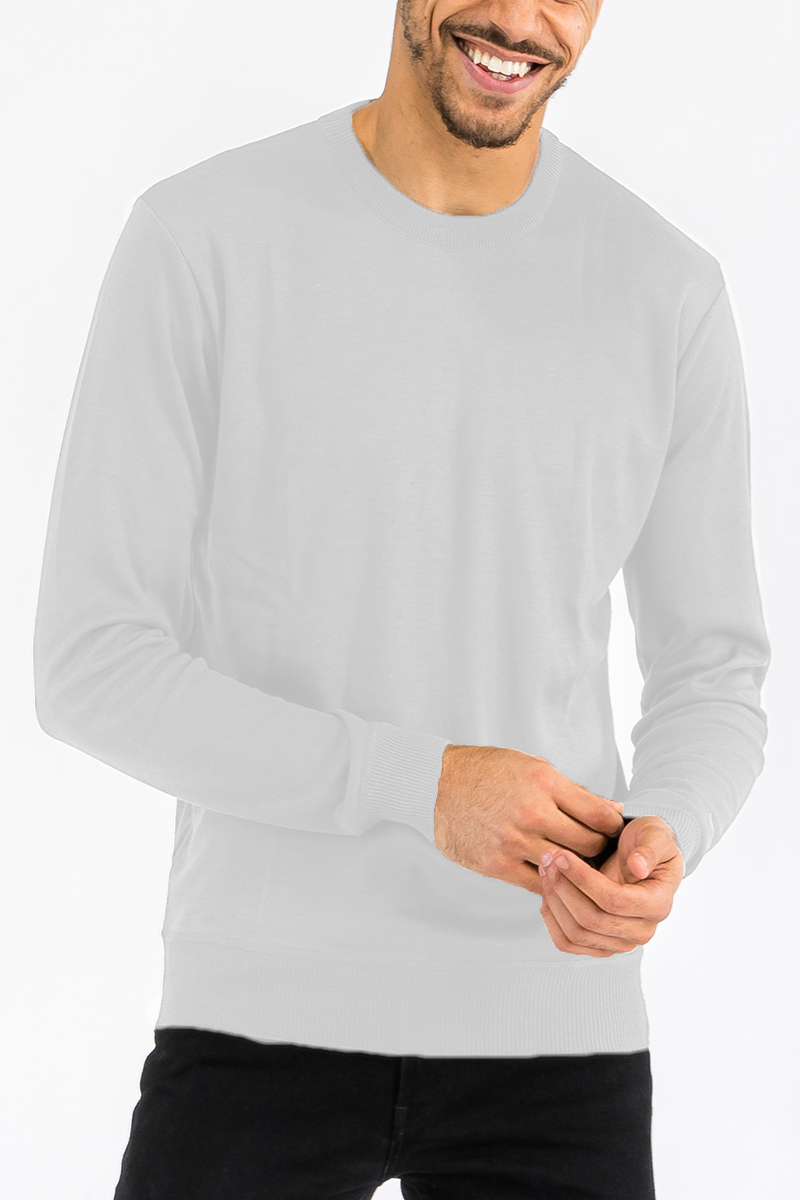 A stylish round neck knit sweater in a soft fabric, showcasing a classic design perfect for casual and layered outfits.