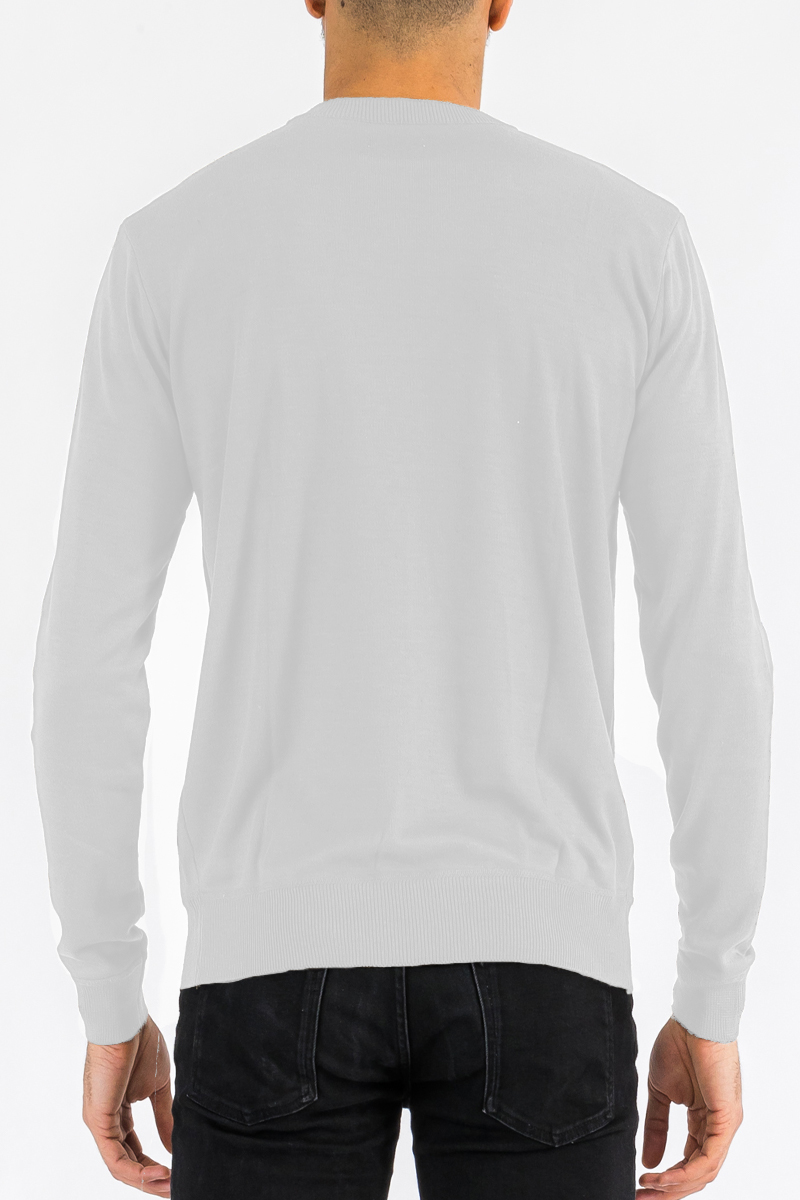 A stylish round neck knit sweater in a soft fabric, showcasing a classic design perfect for casual and layered outfits.