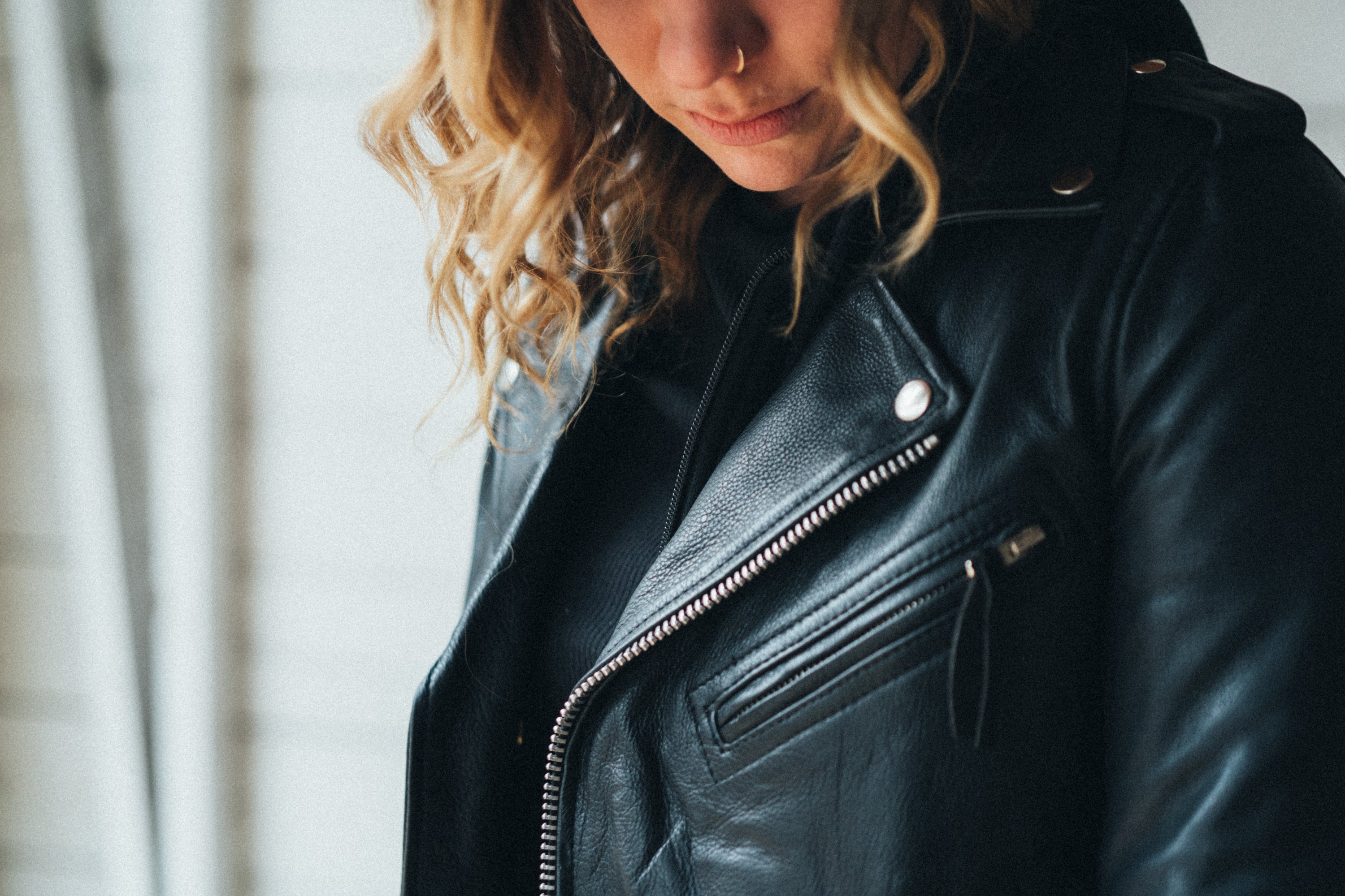 Ryman-FS motorcycle jacket featuring a snap-down lapel, asymmetrical zipper, and multiple pockets for storage.