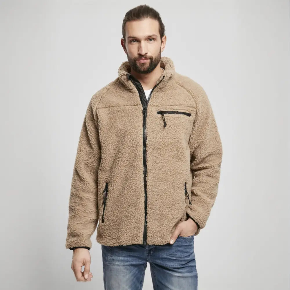 A cozy Teddyfleece Jacket featuring a deep pile fleece exterior, high stand-up collar, and multiple zippered pockets for convenience.