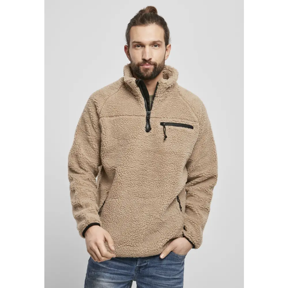 Teddyfleece Troyer in deep-pile fleece with high stand-up collar, featuring multiple zippered pockets and elastic cuffs for a snug fit.