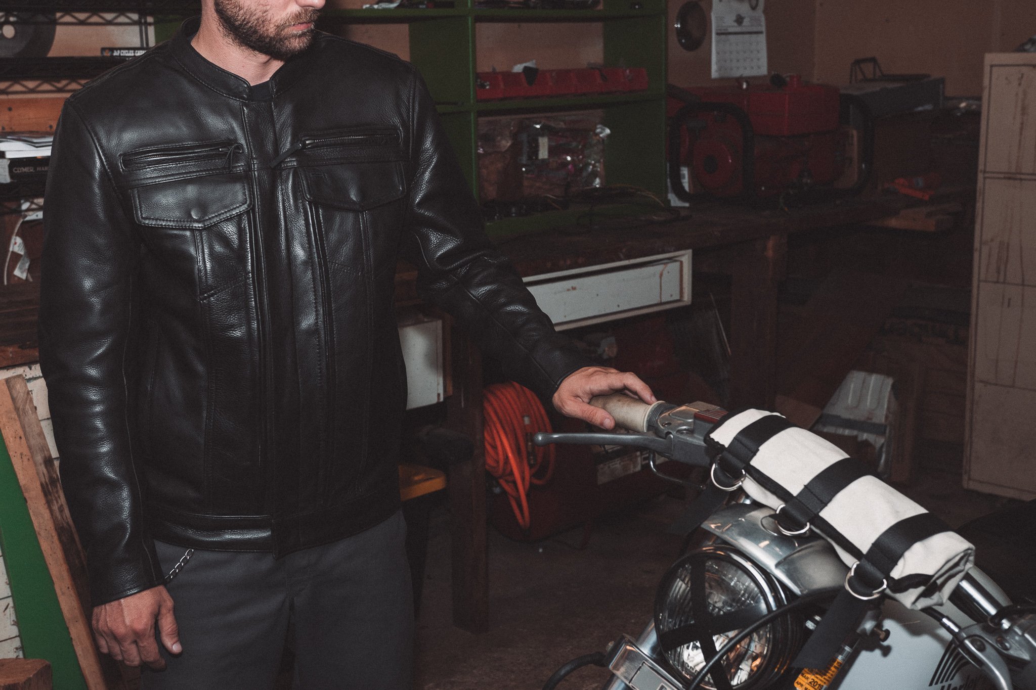 The Raider Men's Motorcycle Leather Jacket in black, showcasing premium cowhide leather and multiple pockets.