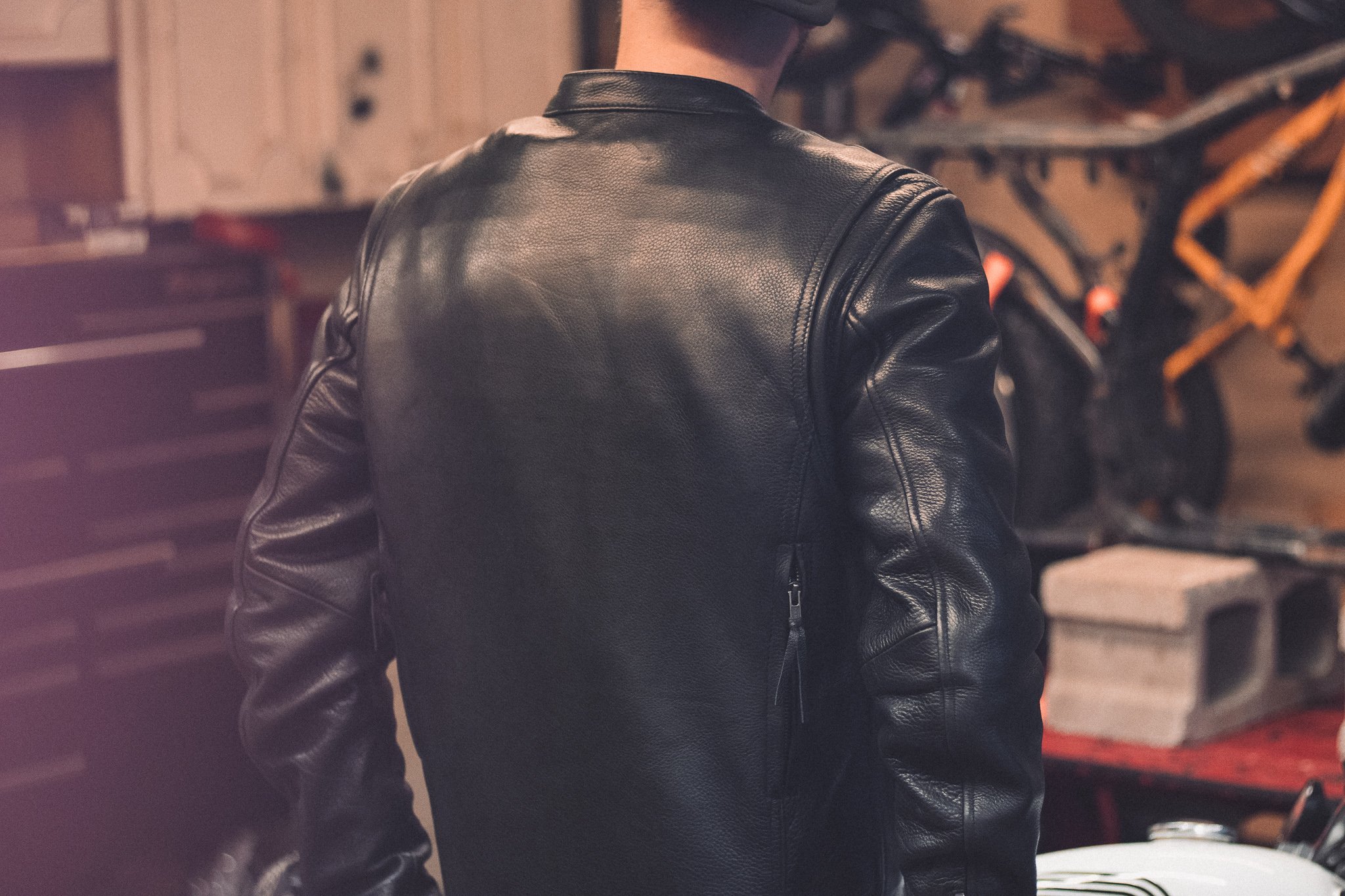 The Raider Men's Motorcycle Leather Jacket in black, showcasing premium cowhide leather and multiple pockets.