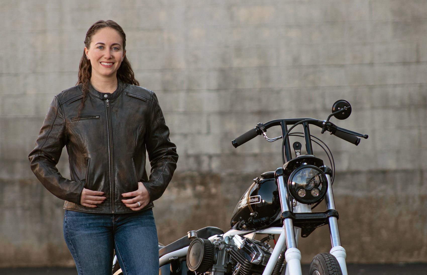 Trickster Women's Leather Motorcycle Jacket featuring a stylish scooter design with multiple zippered pockets and armored protection.