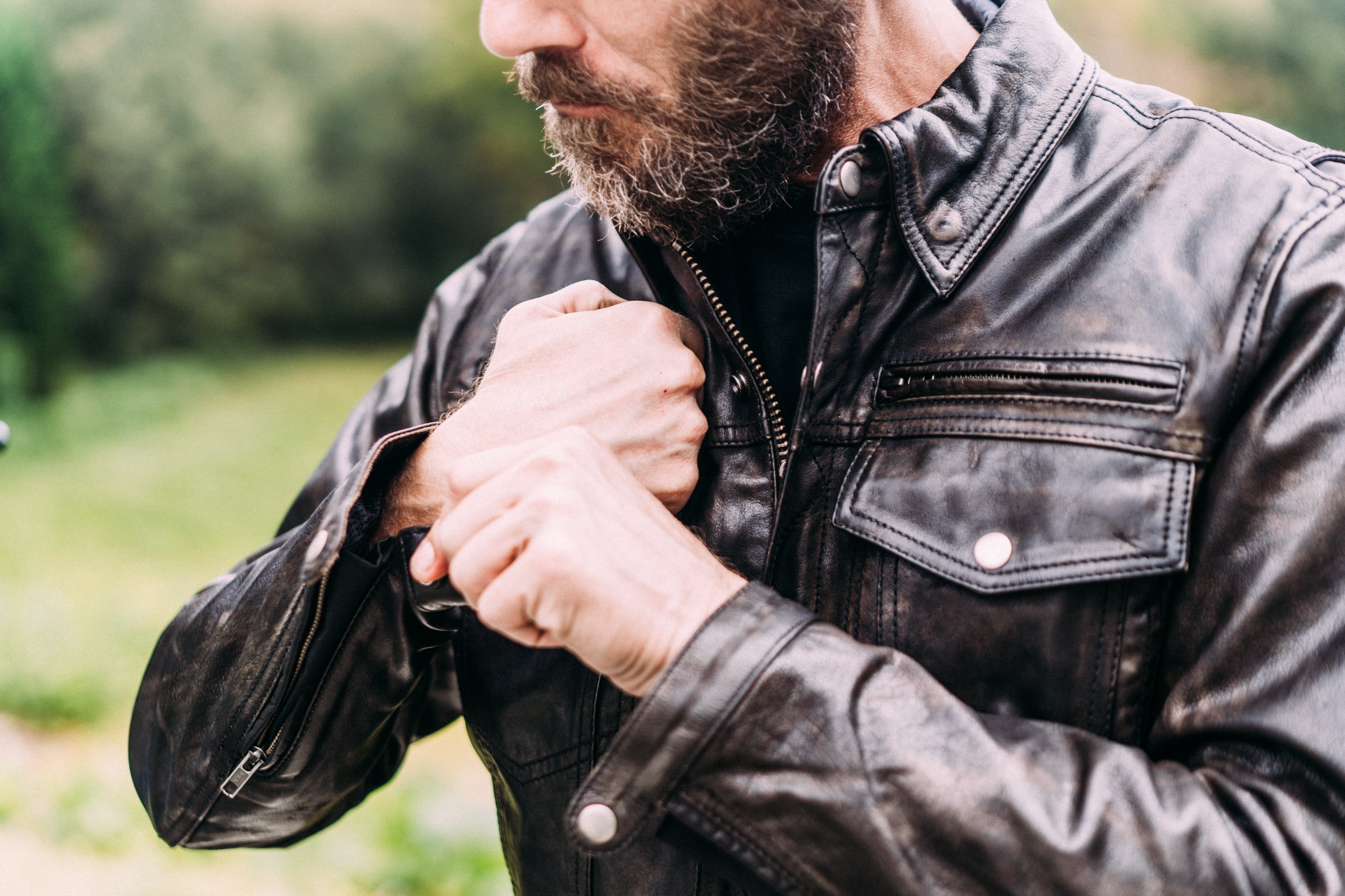 Villain Men's Leather Motorcycle Jacket featuring a stylish scooter design with multiple pockets and a banded collar.