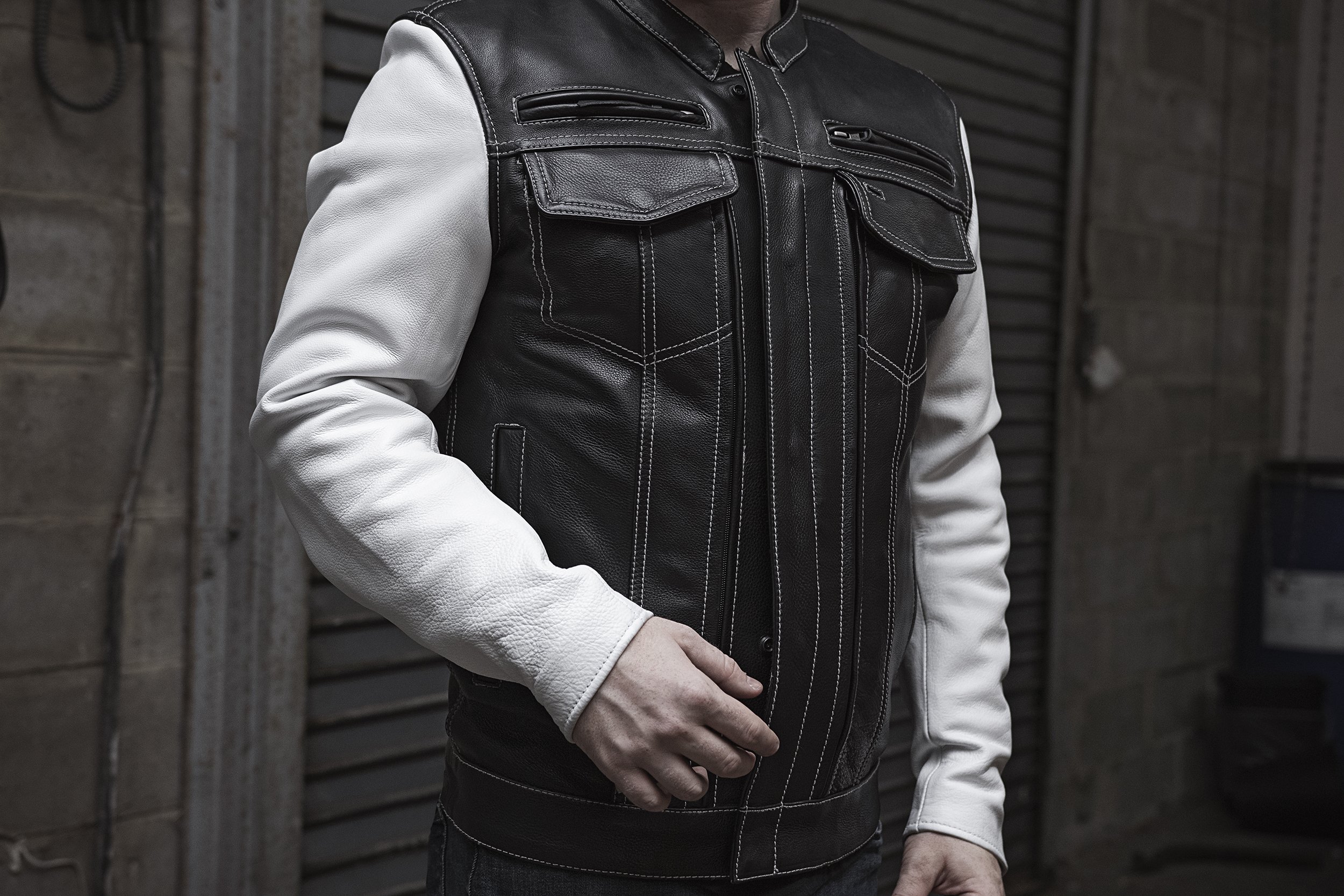 Vincent Men's Scooter Style Leather Jacket featuring black body and white sleeves with multiple pockets and stylish design.