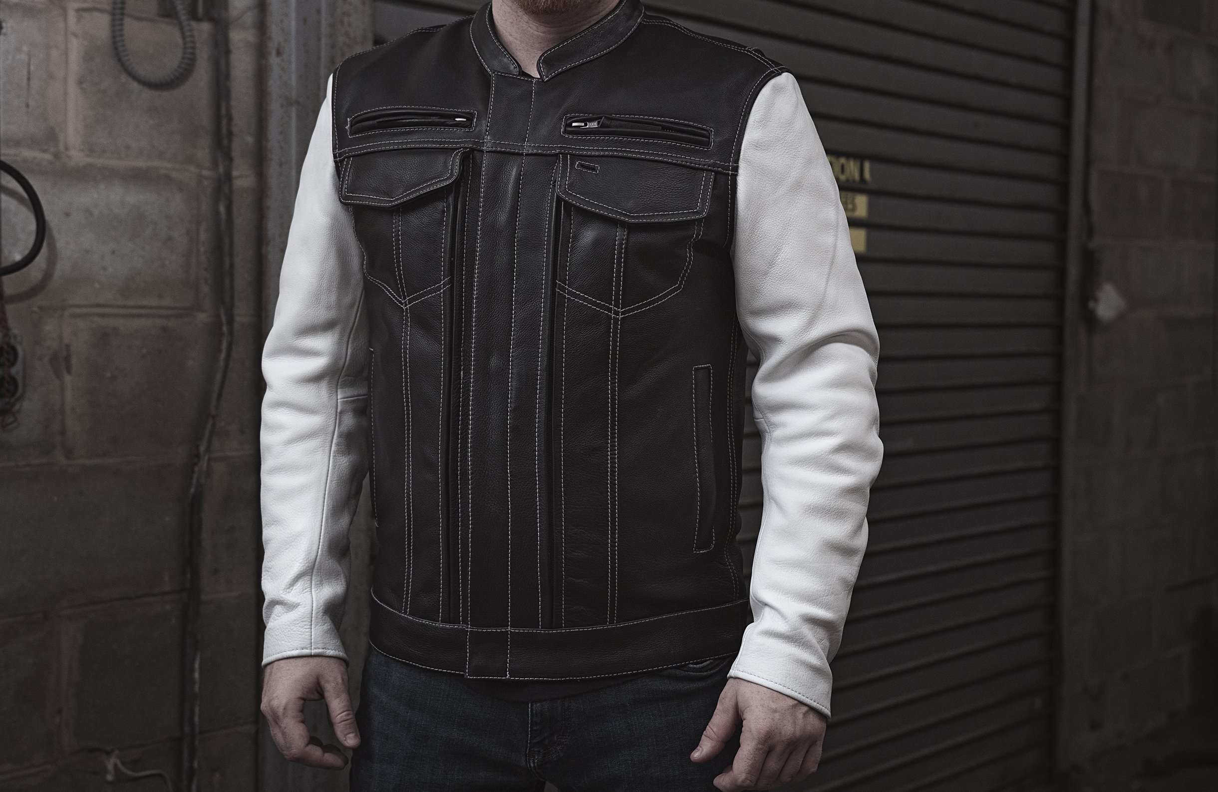 Vincent Men's Scooter Style Leather Jacket featuring black body and white sleeves with multiple pockets and stylish design.