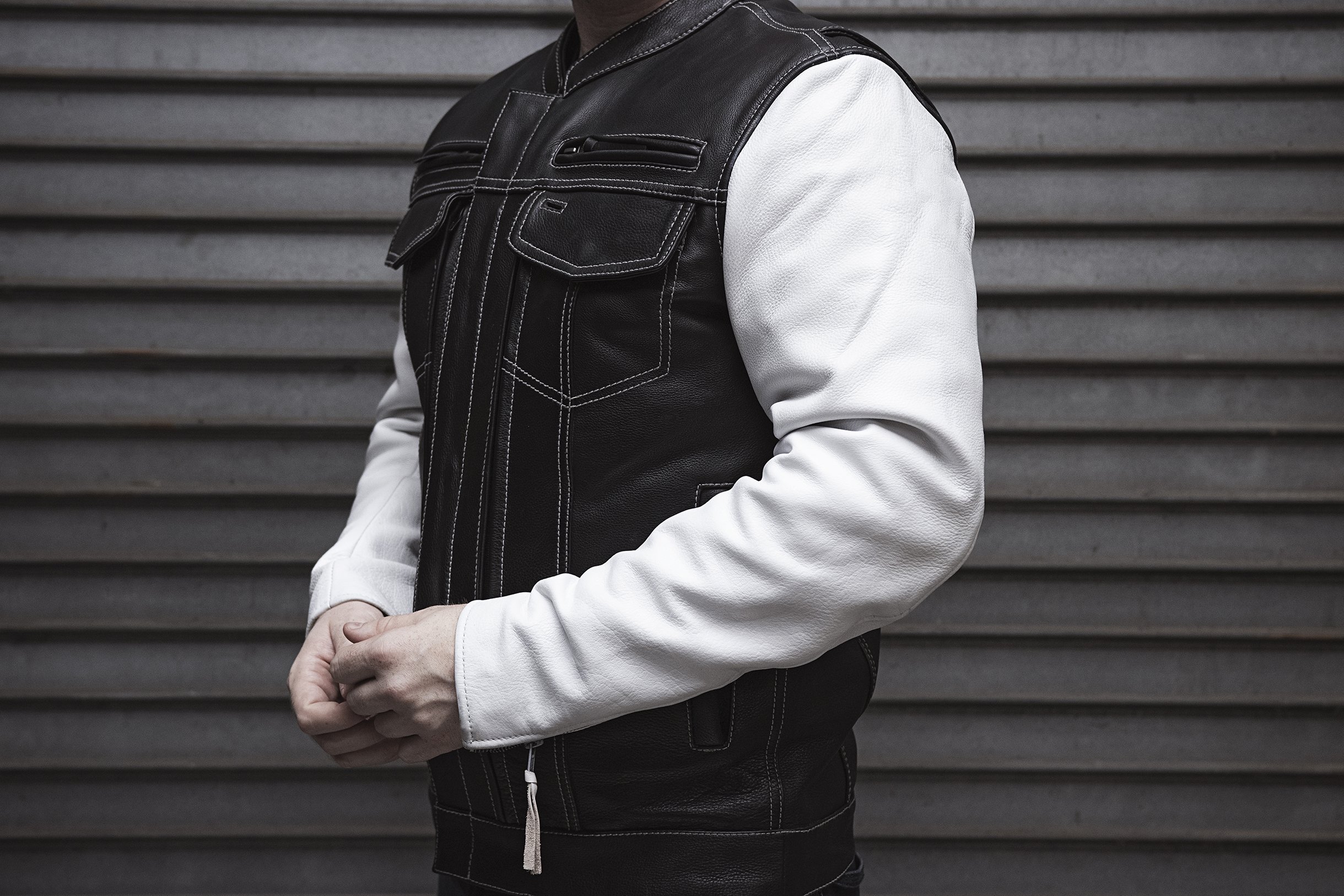 Vincent Men's Scooter Style Leather Jacket featuring black body and white sleeves with multiple pockets and stylish design.