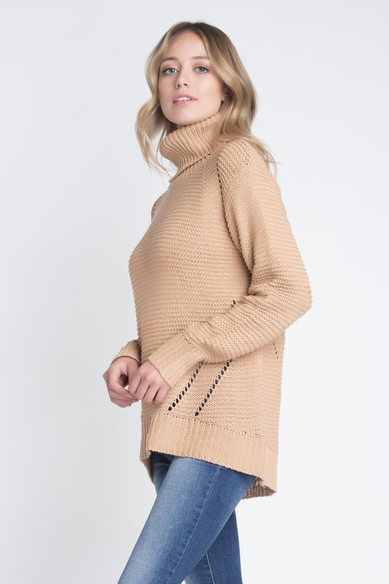 A stylish Women's Loose Fit Hi-Low Turtleneck Sweater in a cozy knit fabric, featuring a turtleneck and a trendy hi-low hem.