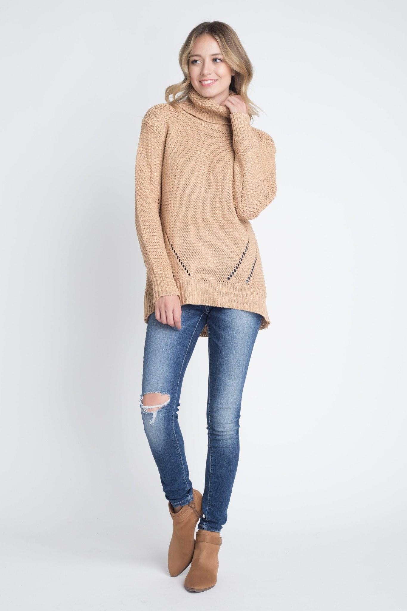 A stylish Women's Loose Fit Hi-Low Turtleneck Sweater in a cozy knit fabric, featuring a turtleneck and a trendy hi-low hem.