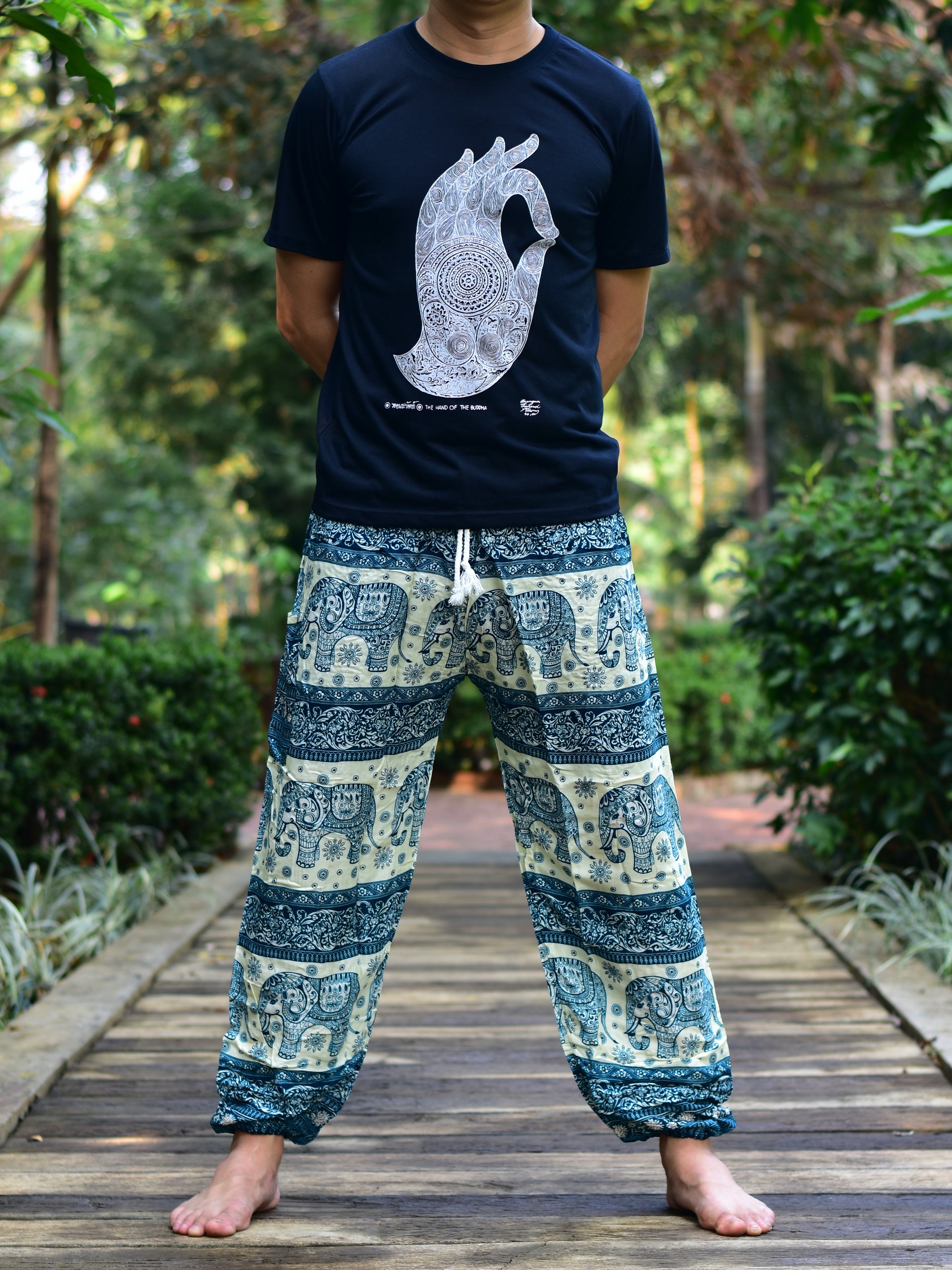 Bohotusk Men's Green Elephant Herd Print Harem Pants showcasing vibrant colors and unique design, featuring an elasticated waist and ankle.