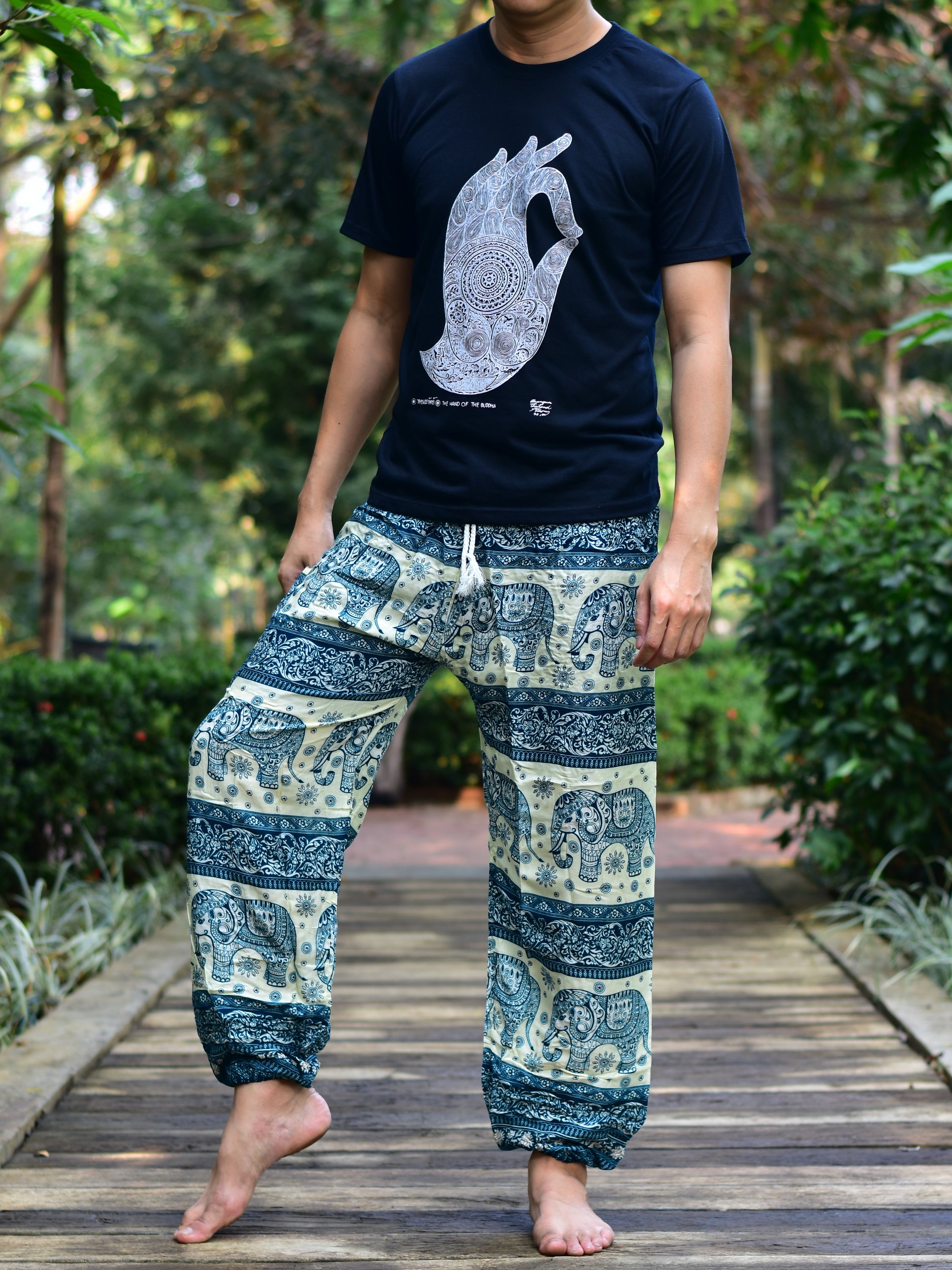 Bohotusk Men's Green Elephant Herd Print Harem Pants showcasing vibrant colors and unique design, featuring an elasticated waist and ankle.