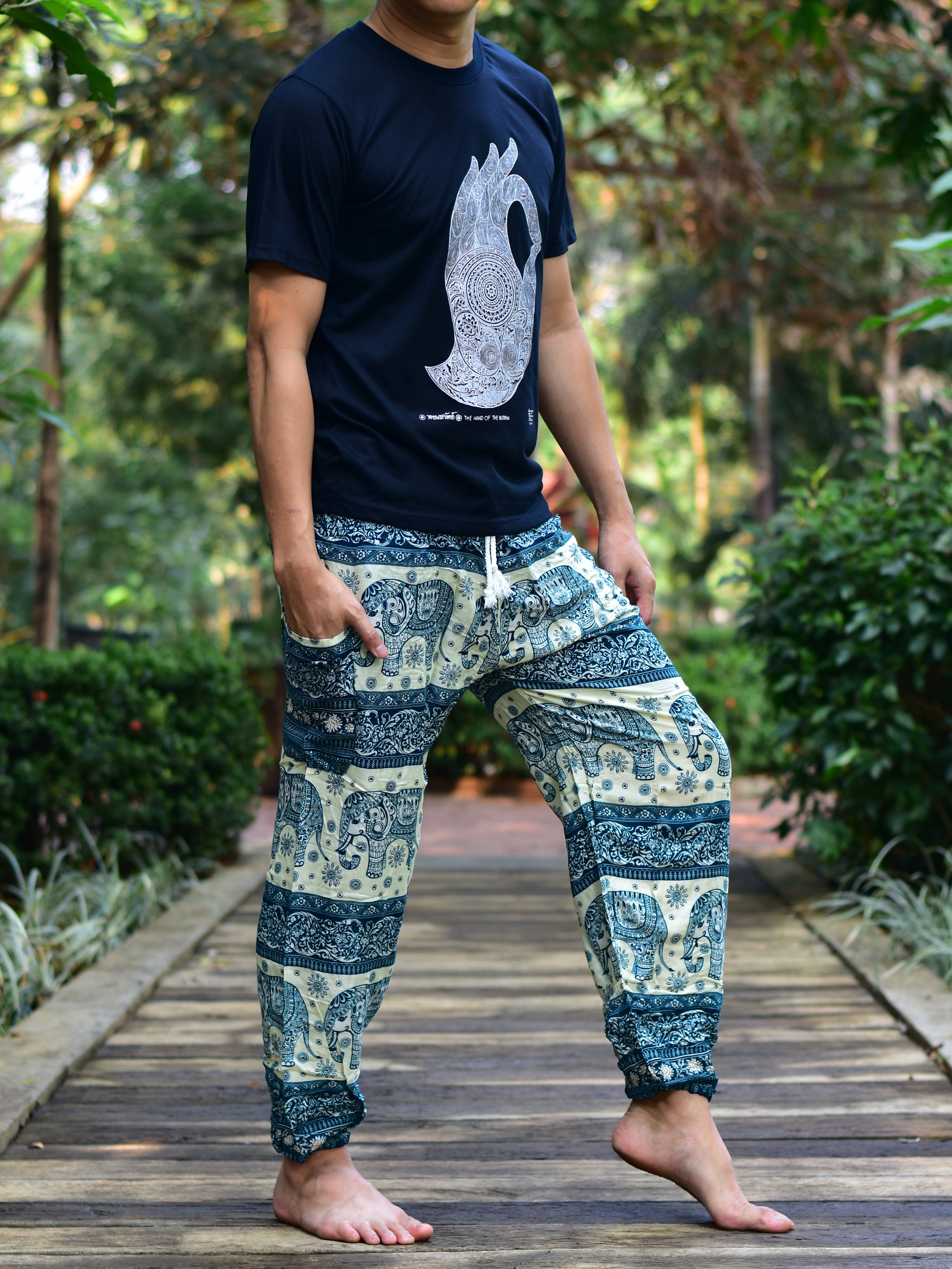 Bohotusk Men's Green Elephant Herd Print Harem Pants showcasing vibrant colors and unique design, featuring an elasticated waist and ankle.