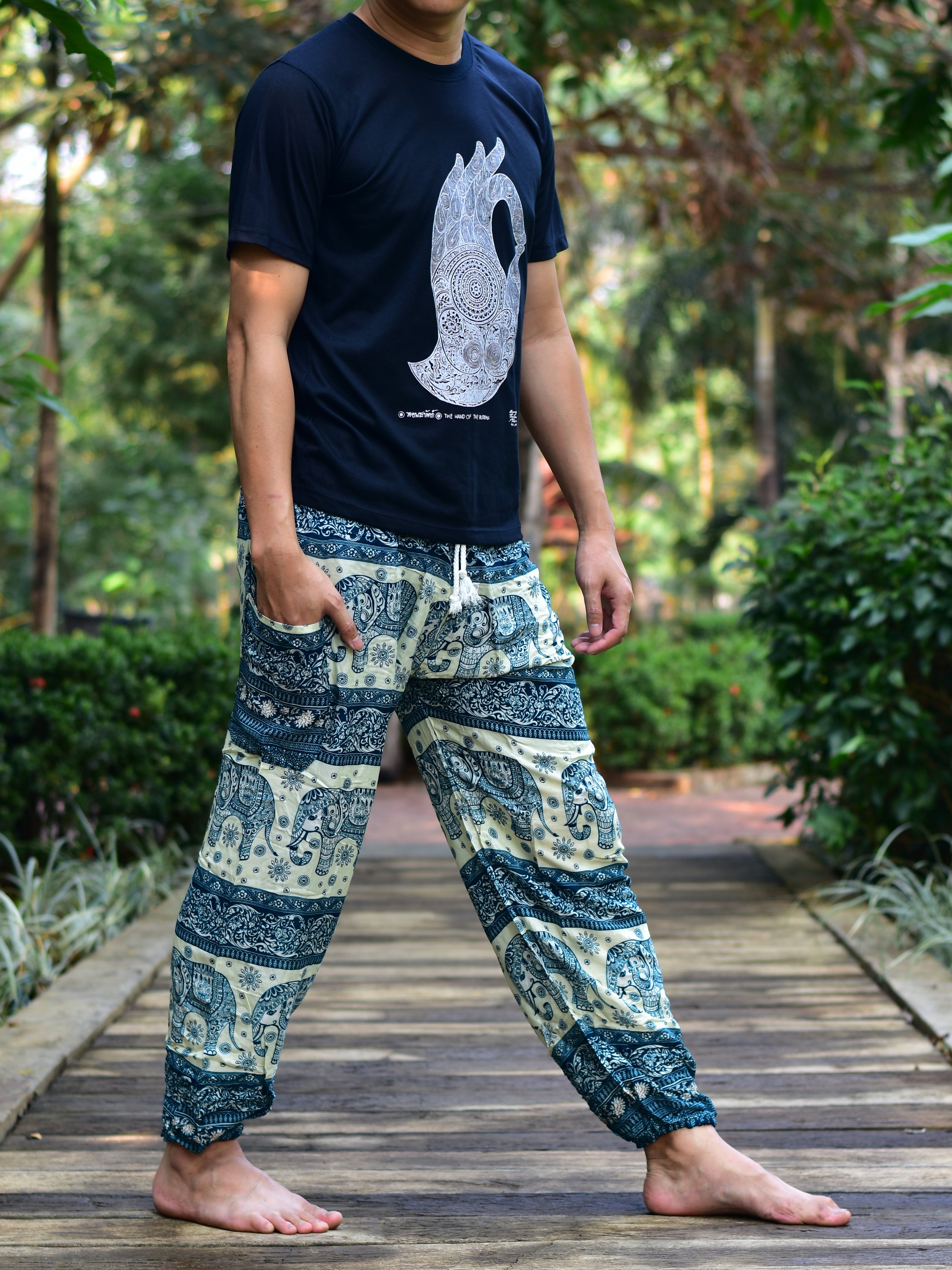 Bohotusk Men's Green Elephant Herd Print Harem Pants showcasing vibrant colors and unique design, featuring an elasticated waist and ankle.