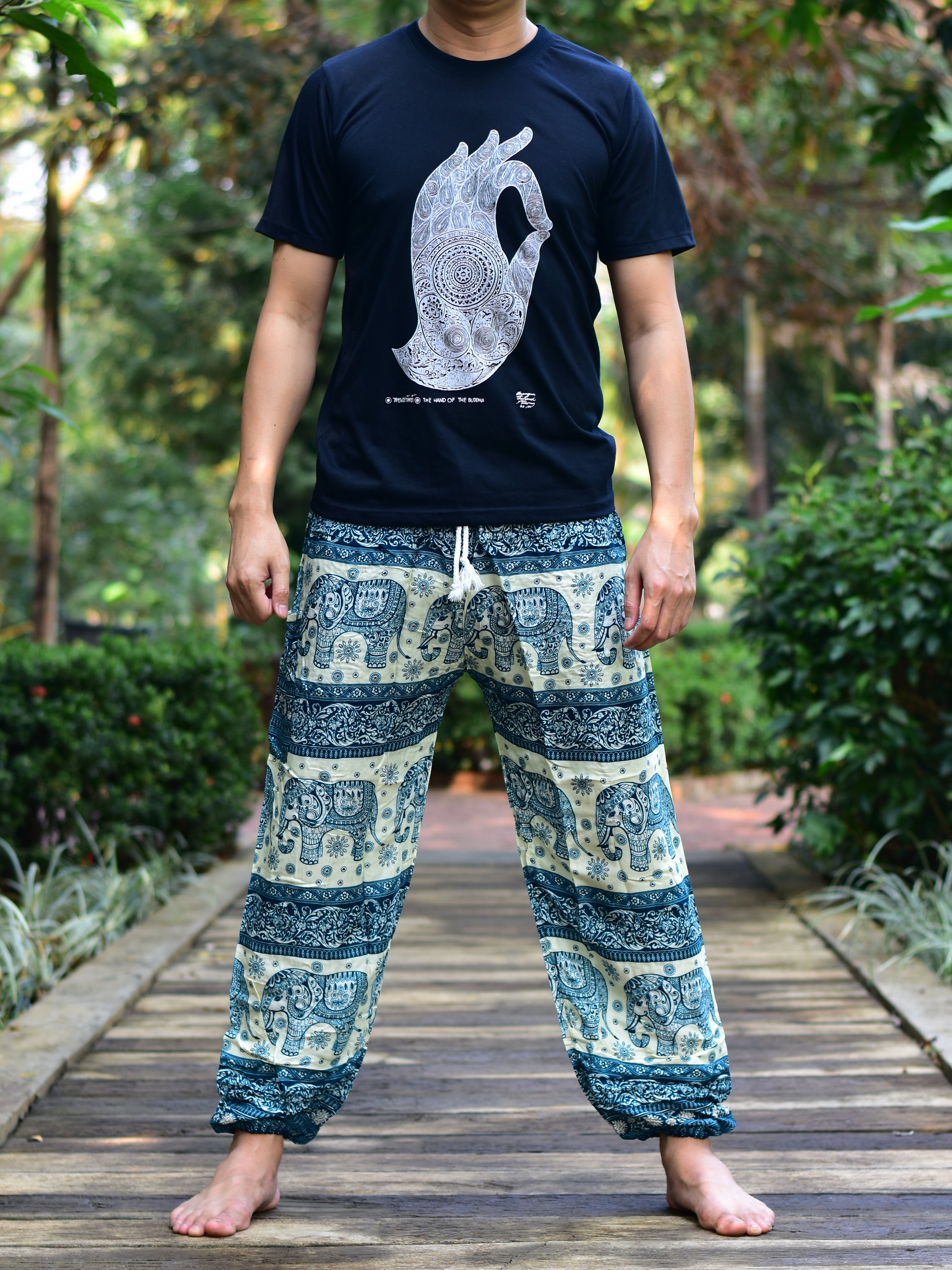 Bohotusk Men's Green Elephant Herd Print Harem Pants showcasing vibrant colors and unique design, featuring an elasticated waist and ankle.