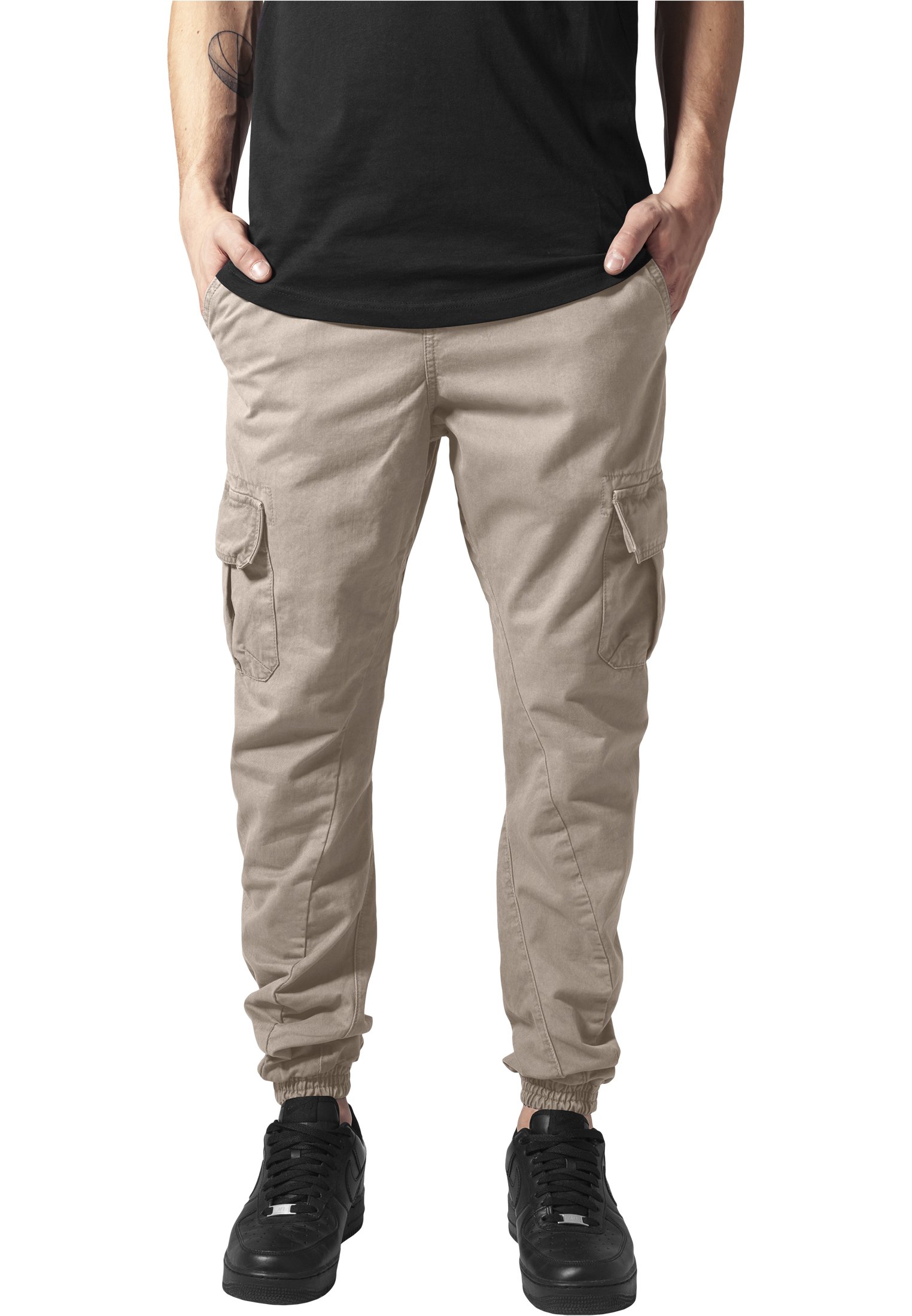 A pair of stylish cargo jogging pants made from 100% cotton, featuring multiple pockets and an elastic waistband for comfort.