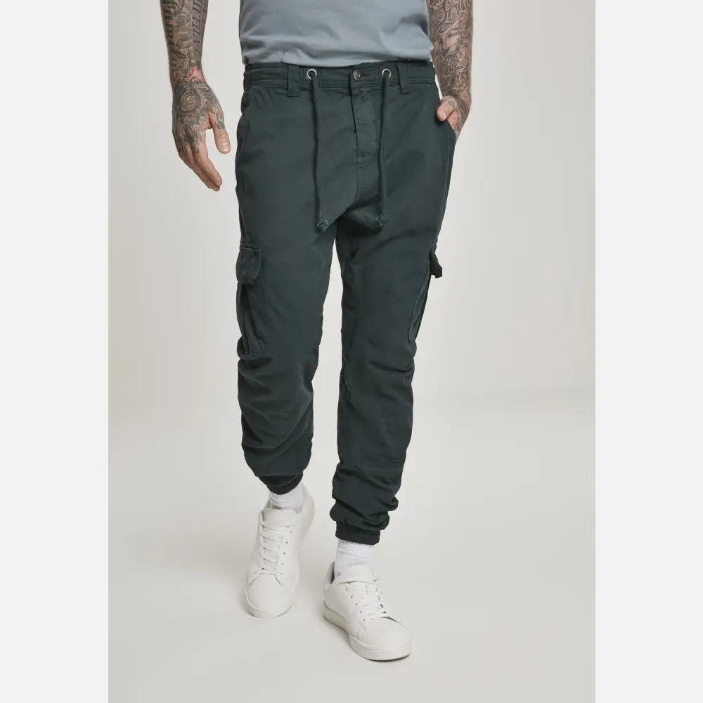 A pair of stylish cargo jogging pants made from 100% cotton, featuring multiple pockets and an elastic waistband for comfort.