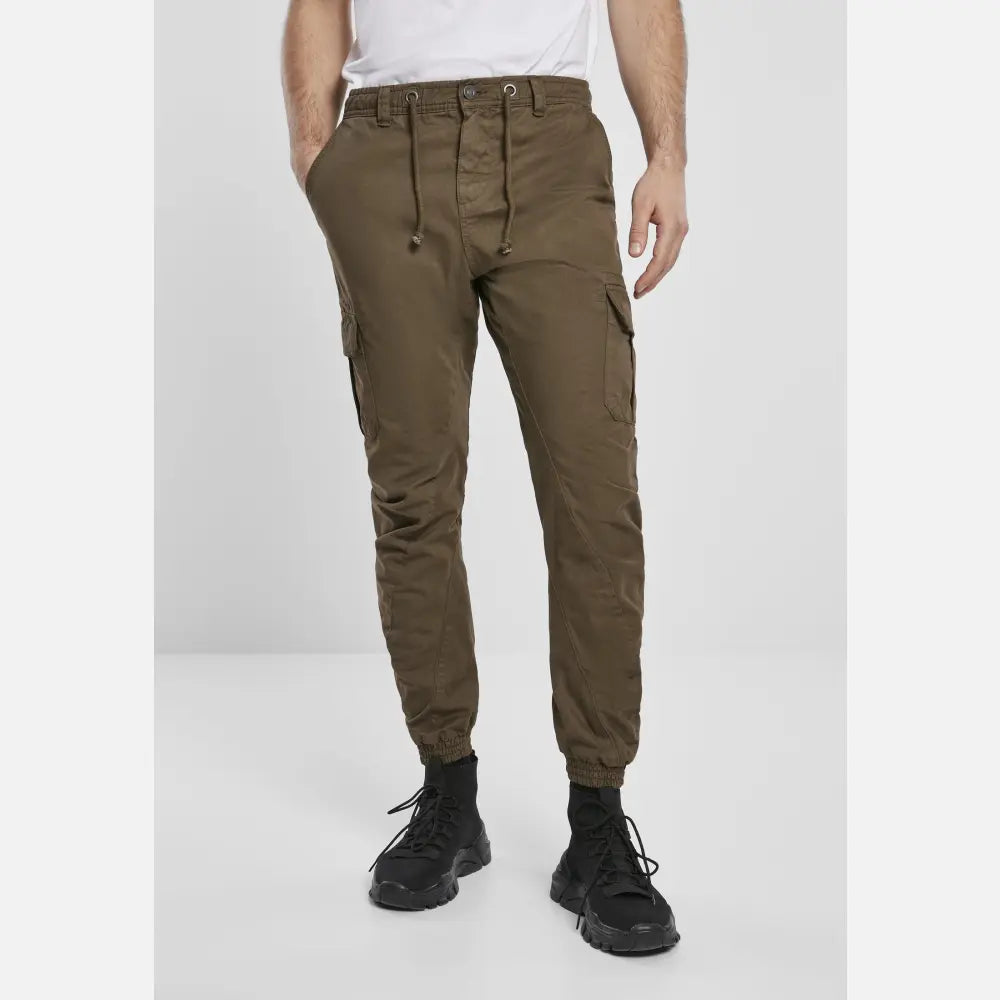 A pair of stylish cargo jogging pants made from 100% cotton, featuring multiple pockets and an elastic waistband for comfort.