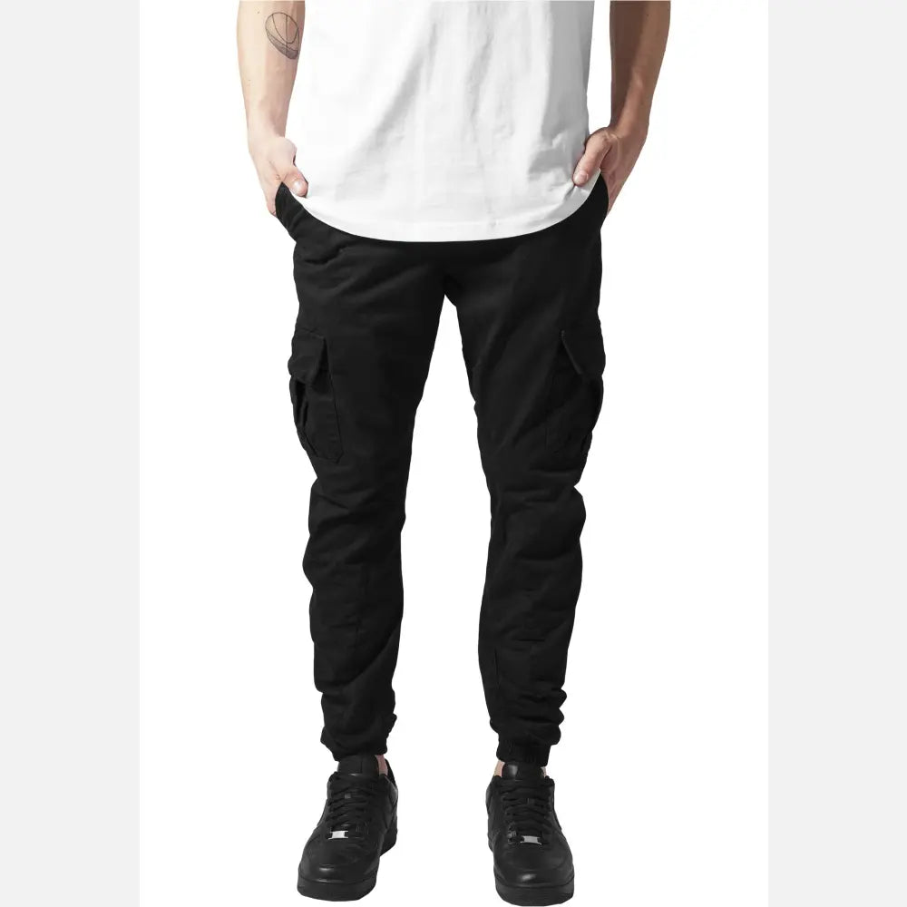 A pair of stylish cargo jogging pants made from 100% cotton, featuring multiple pockets and an elastic waistband for comfort.