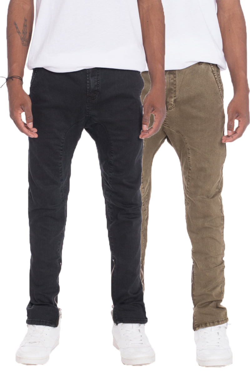 A pair of stylish drop crotch stretch denim jeans featuring a regular fit, standard belt loops, and pockets, made from a soft cotton blend.