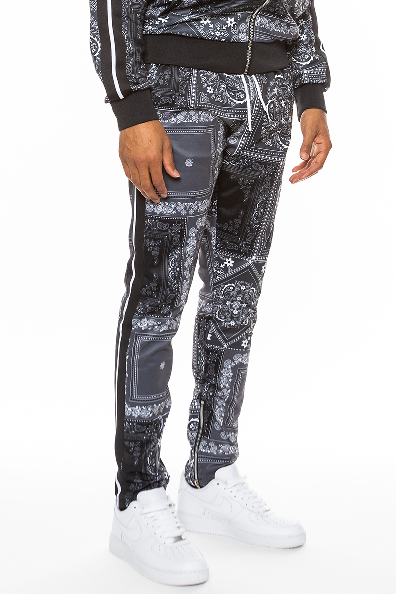 Stylish paisley all over print pants with elastic waist and ankle zippers, perfect for casual and dressy occasions.